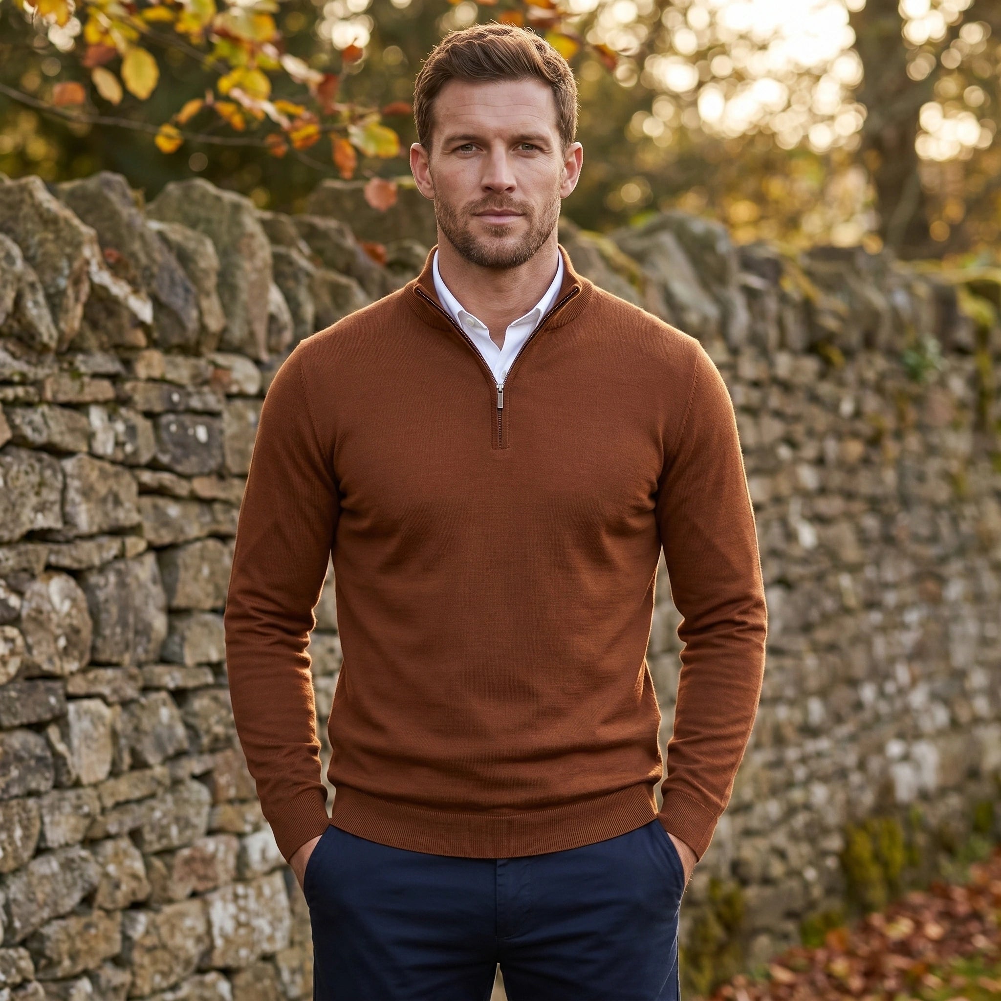 Close up view of the men's fitted quarter zip sweater showing its soft fabric texture, precise stitching, and mock neck design.