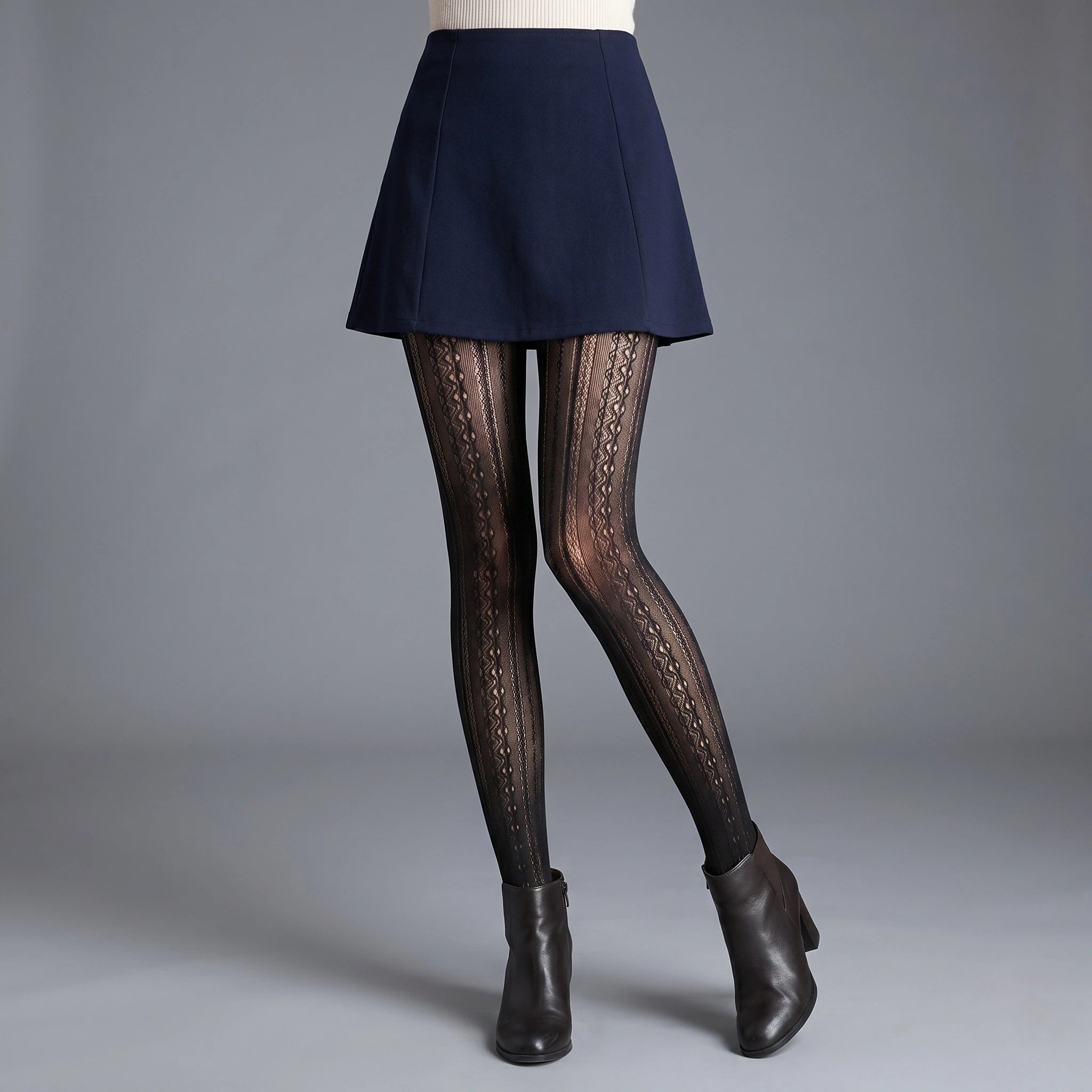 Back view of a model showing women's striped autumn tights, showing the high waisted design and intricate construction details against a neutral background.
