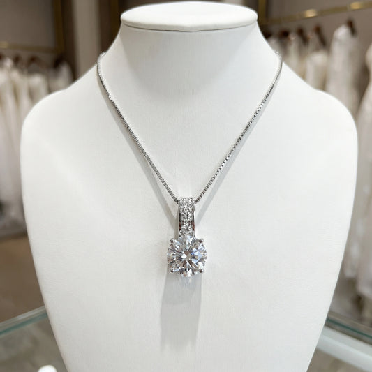 Back view of a model showing the Womens Timeless Bridal Jewelry Set, showing intricate details and craftsmanship against a soft, neutral background.