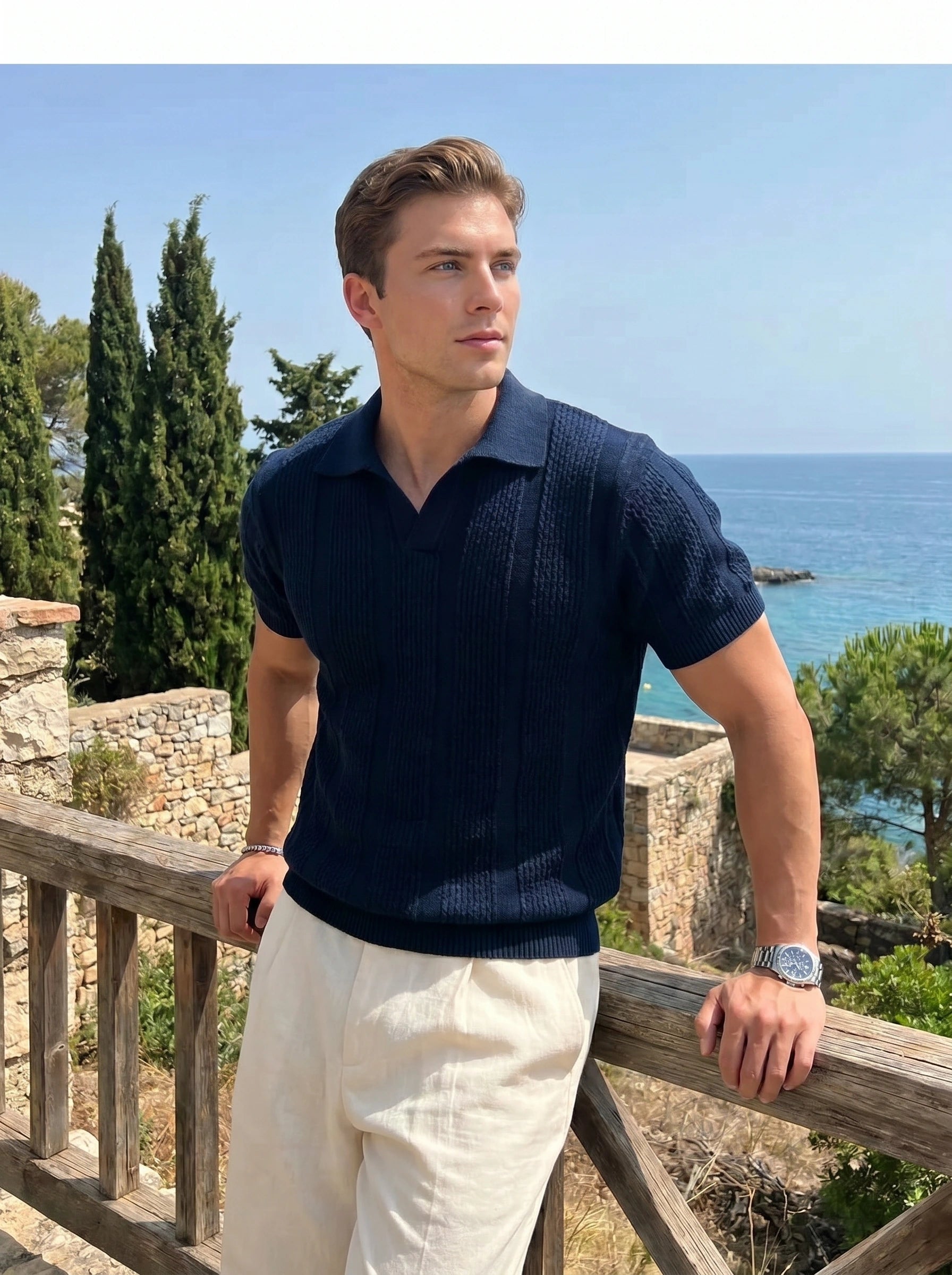 Back view of a model wearing a mens refined relaxed spring polo shirt in a soft pastel color, showing construction details and a casual yet sophisticated style against a light, neutral background.