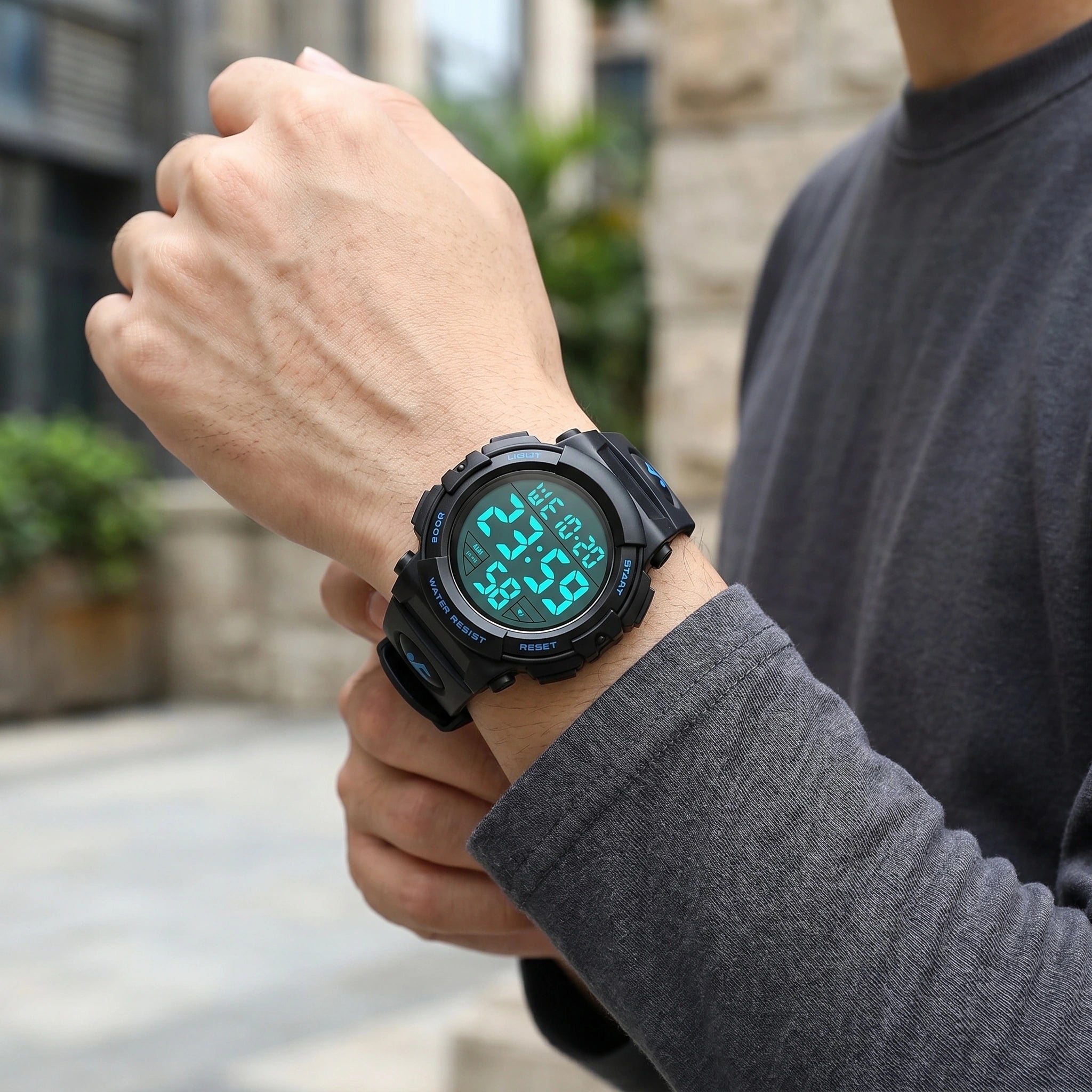 Close up view of the durable fabric and precise stitching of the men's sports watch, showing its robust design and functional features against a neutral background.