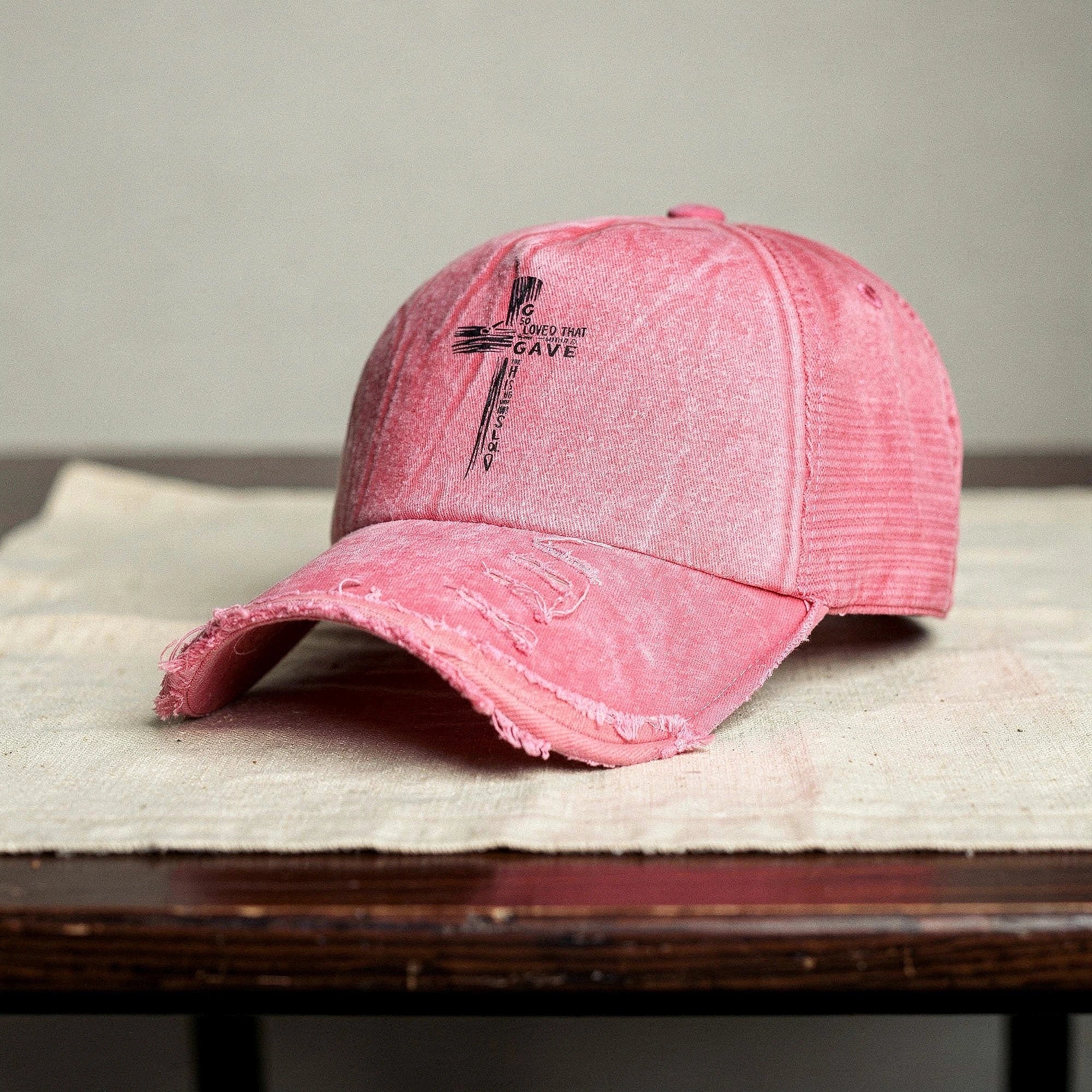 Light pink summer baseball cap made of breathable fabric, featuring a curved brim and adjustable strap, view