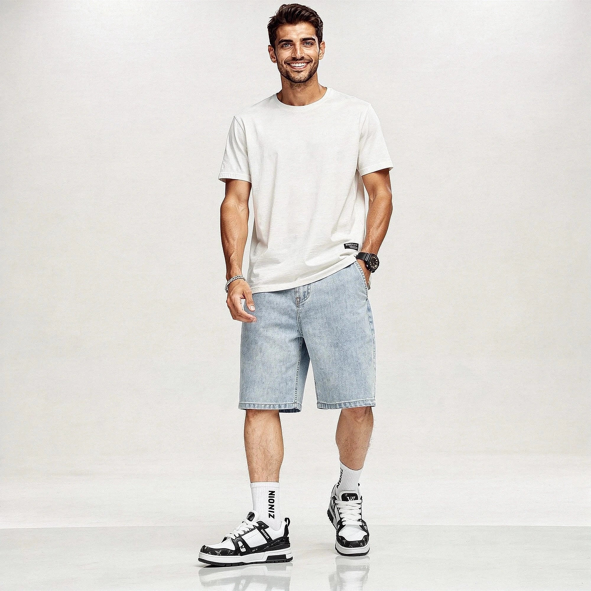 View of trendy loose straight leg denim shorts in light blue, made