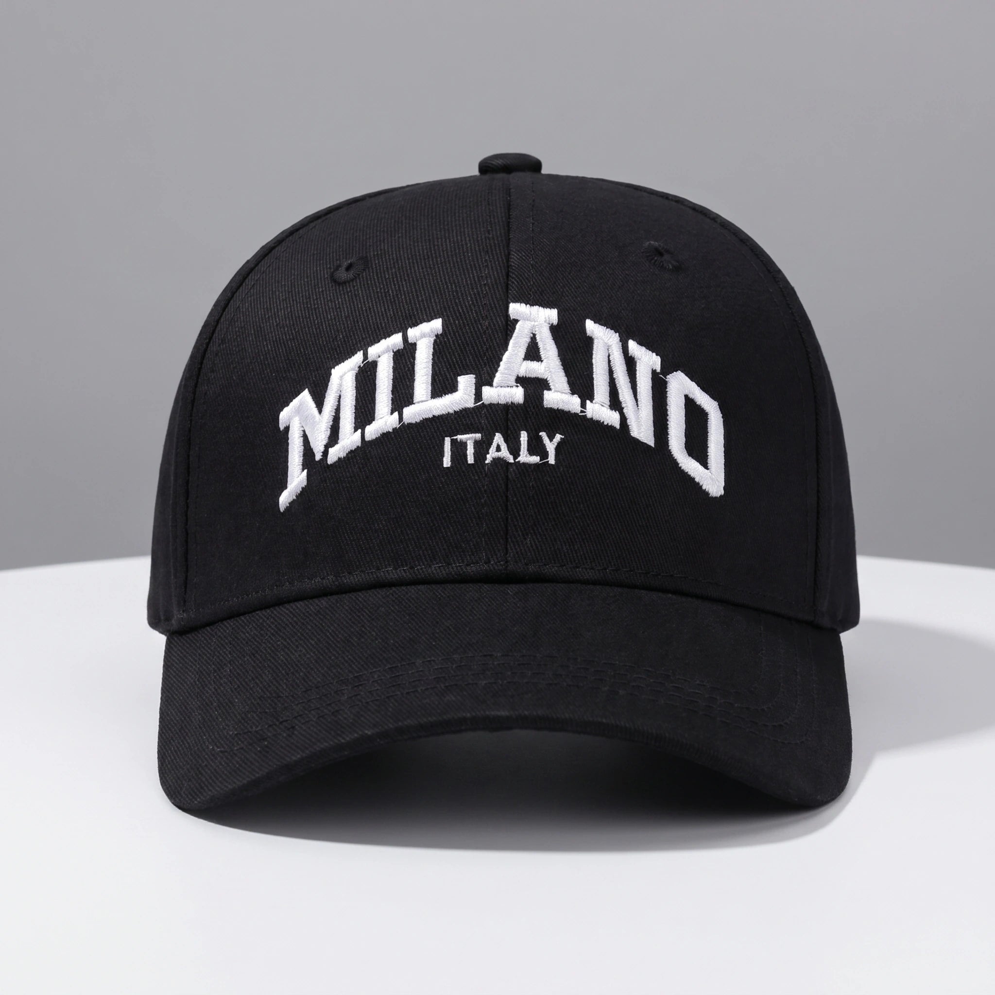 Back view of a adjustable embroidered baseball cap showing its durable construction and design, set against a neutral outdoor background.
