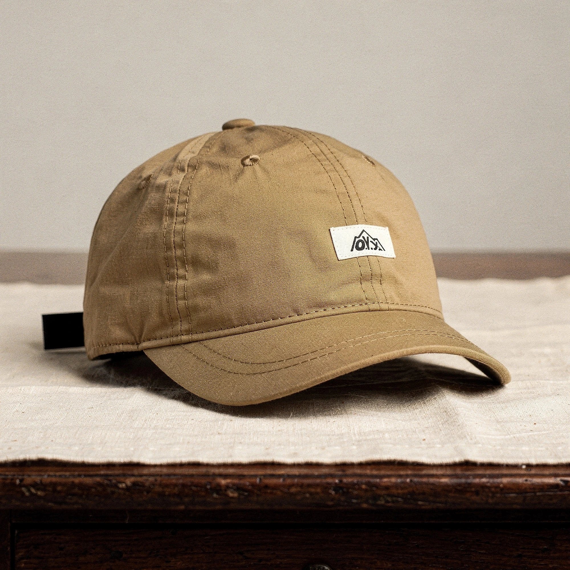 View of a stylish breathable baseball cap in dark navy, featuring a structured design and adjustable strap