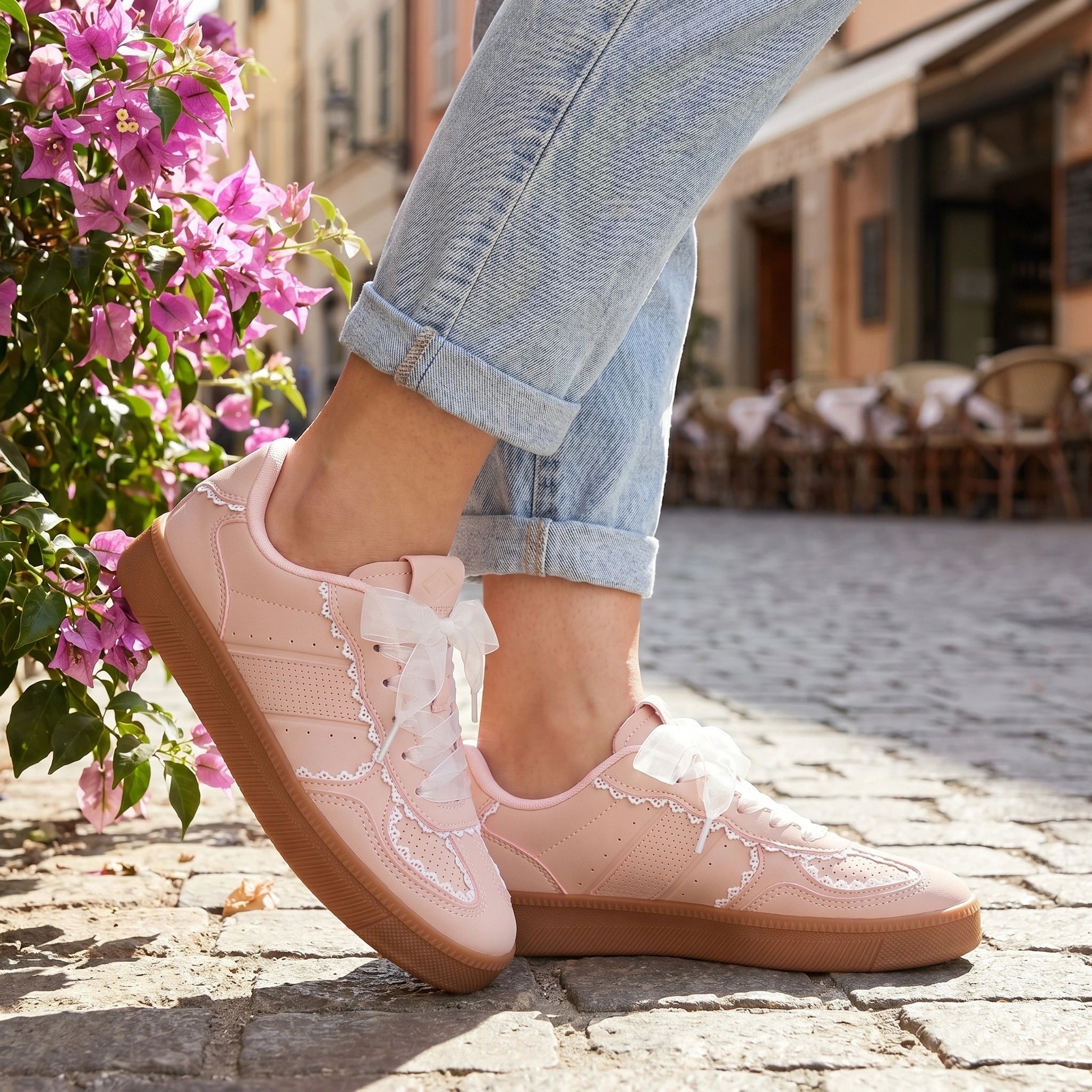 Close up view of the breathable fabric and detailed stitching of women's supportive summer sneakers, showing their design and comfort features.