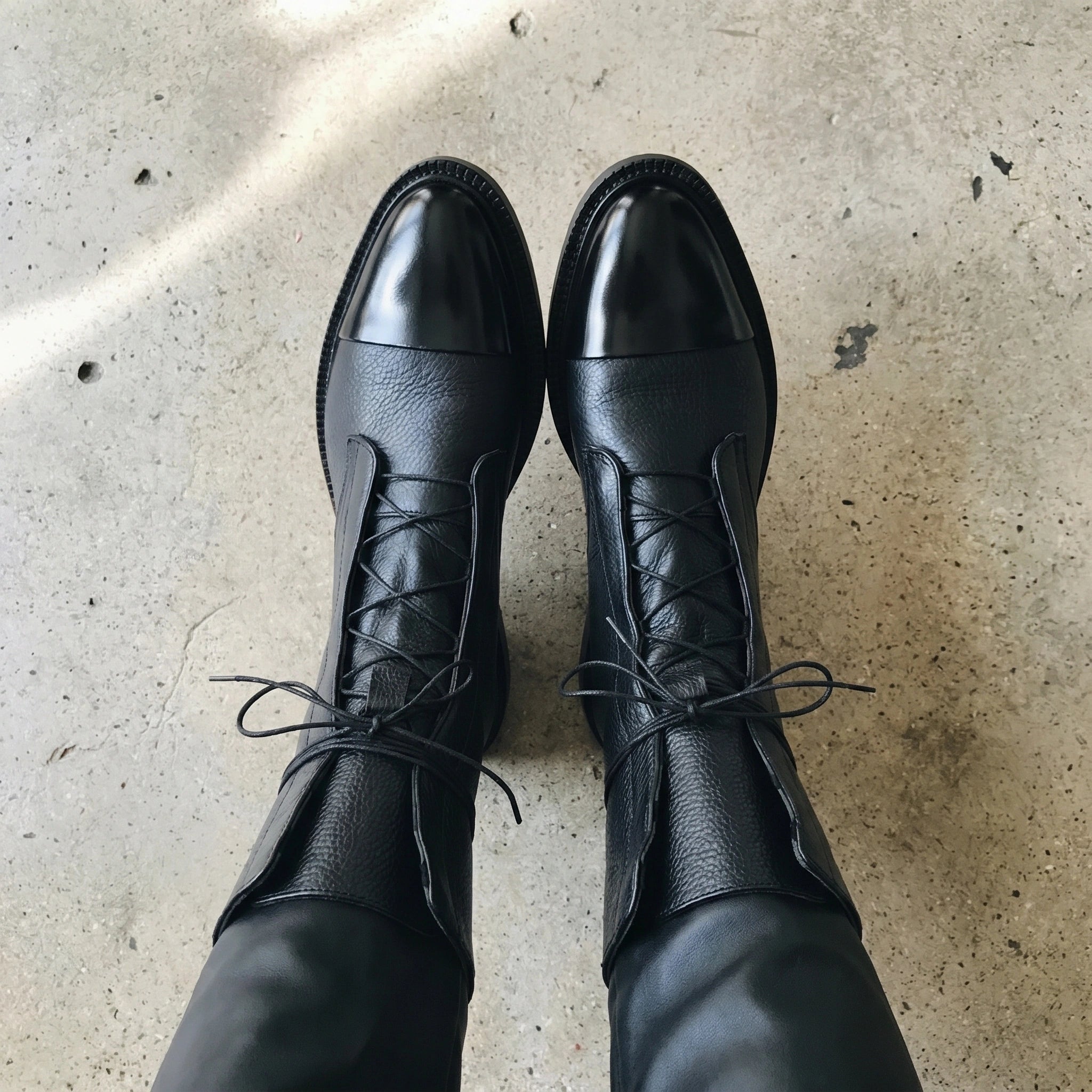 Close up of the Womens Edgy Minimalist Ankle Boots showing the premium fabric and meticulous stitching, showing their sleek and modern design.
