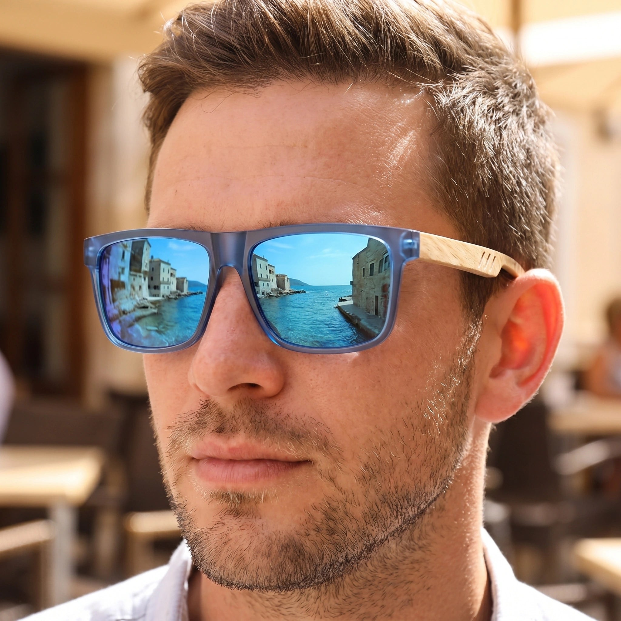 Close up view of the vintage square frame sunglasses showing intricate detailing, showing the polished finish and sophisticated design elements against a neutral background.