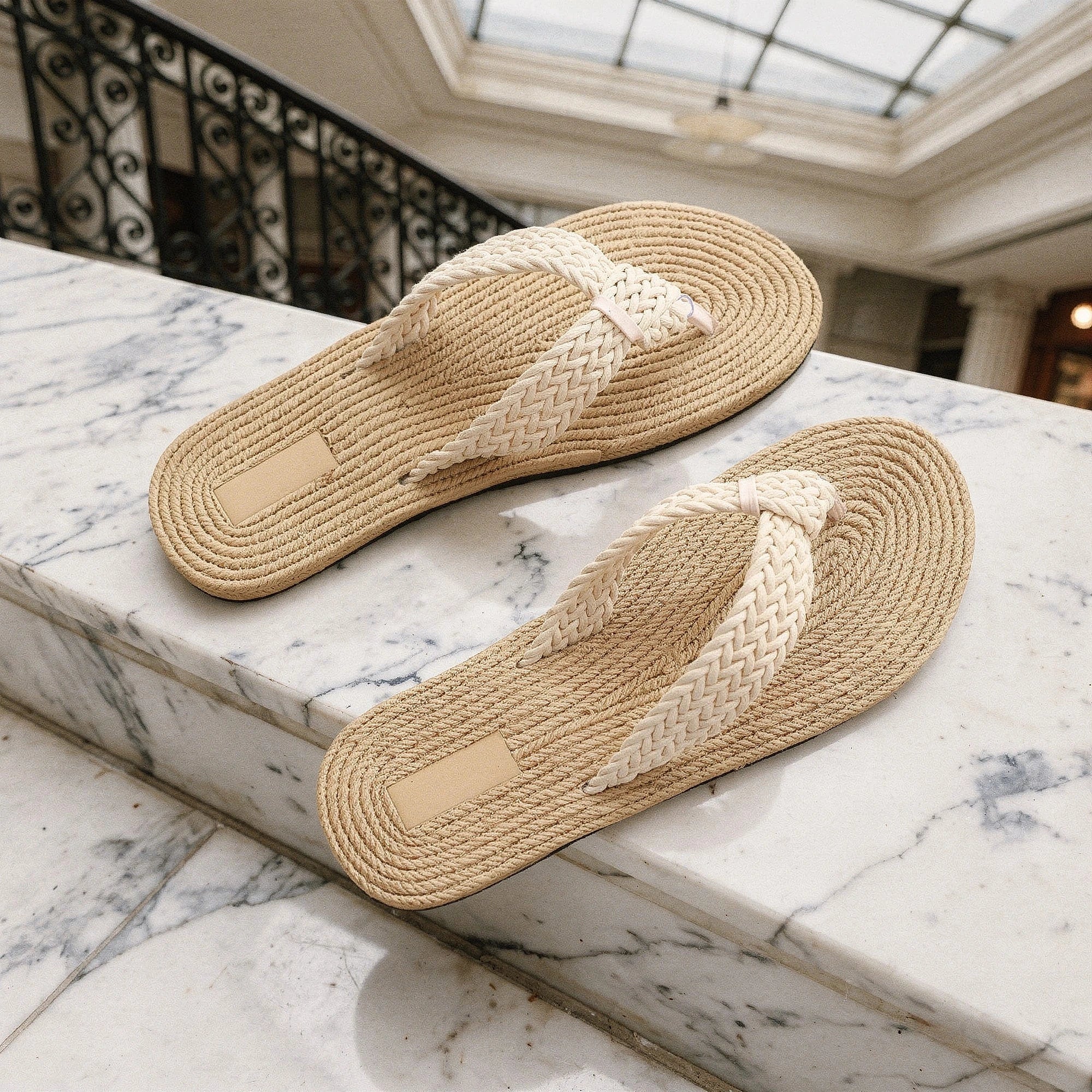 View of relaxed textured imitation hemp flip flops in beige, showcasing the soft material and comfortable sole