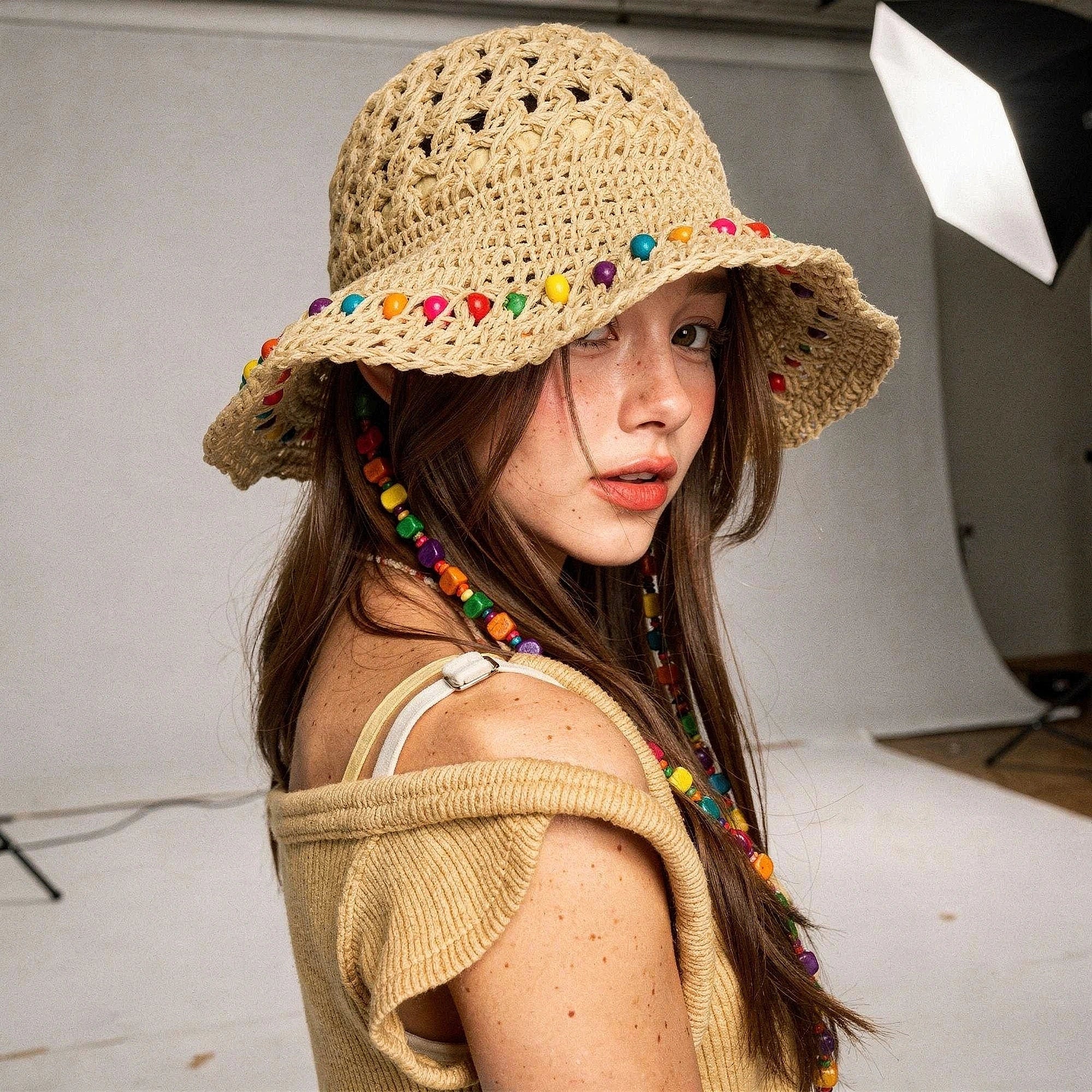 Colorful crochet summer bucket hat in vibrant hues, featuring a wide brim and textured design, view