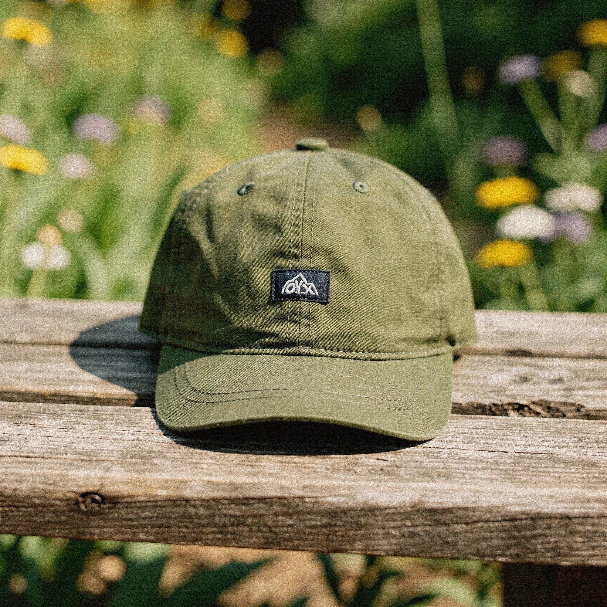 View of a stylish men's baseball cap in dark blue, made from breathable fabric, featuring a curved brim and adjustable strap