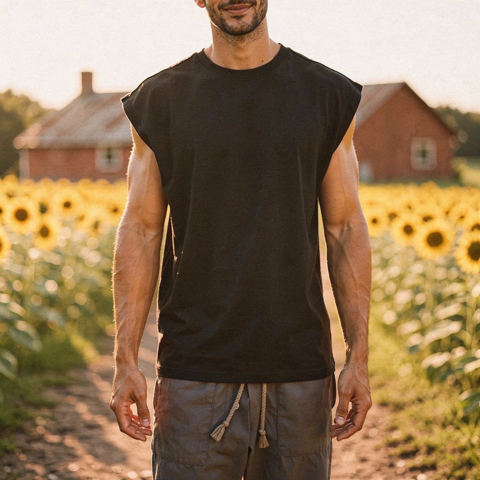 View of a sleek, comfortable summer tank top in light gray fabric, featuring a relaxed fit and wide armholes