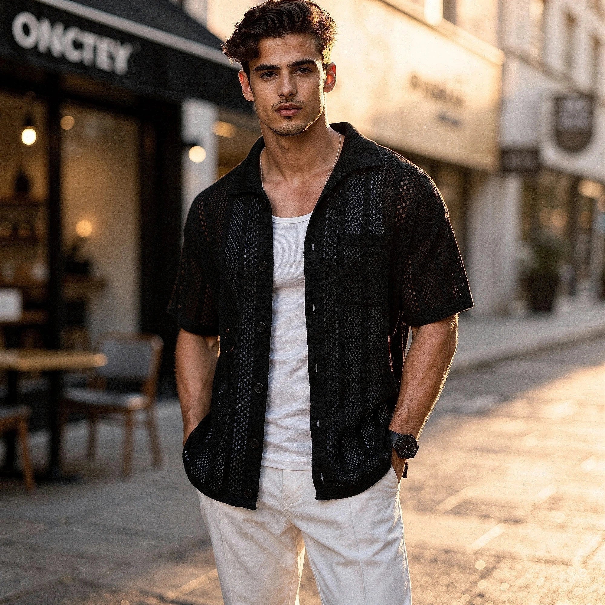 View of a relaxed fit short sleeve shirt in light blue, featuring a classic collar and a subtle texture