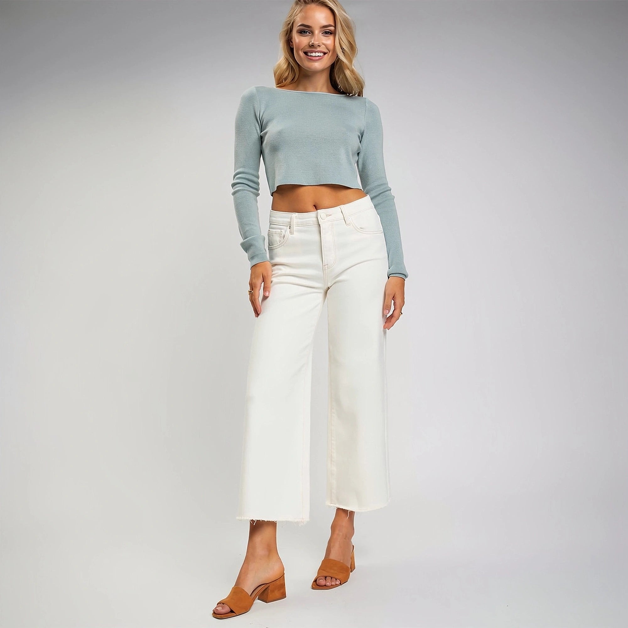 View of high rise crop wide jeans in dark blue denim, featuring tummy control design and a flattering fit