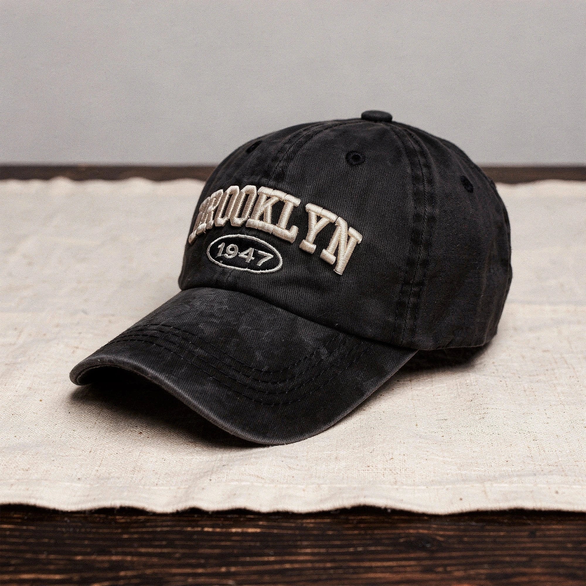 View of a men's casual cap featuring intricate embroidery, in a soft fabric, with a relaxed fit and adjustable strap