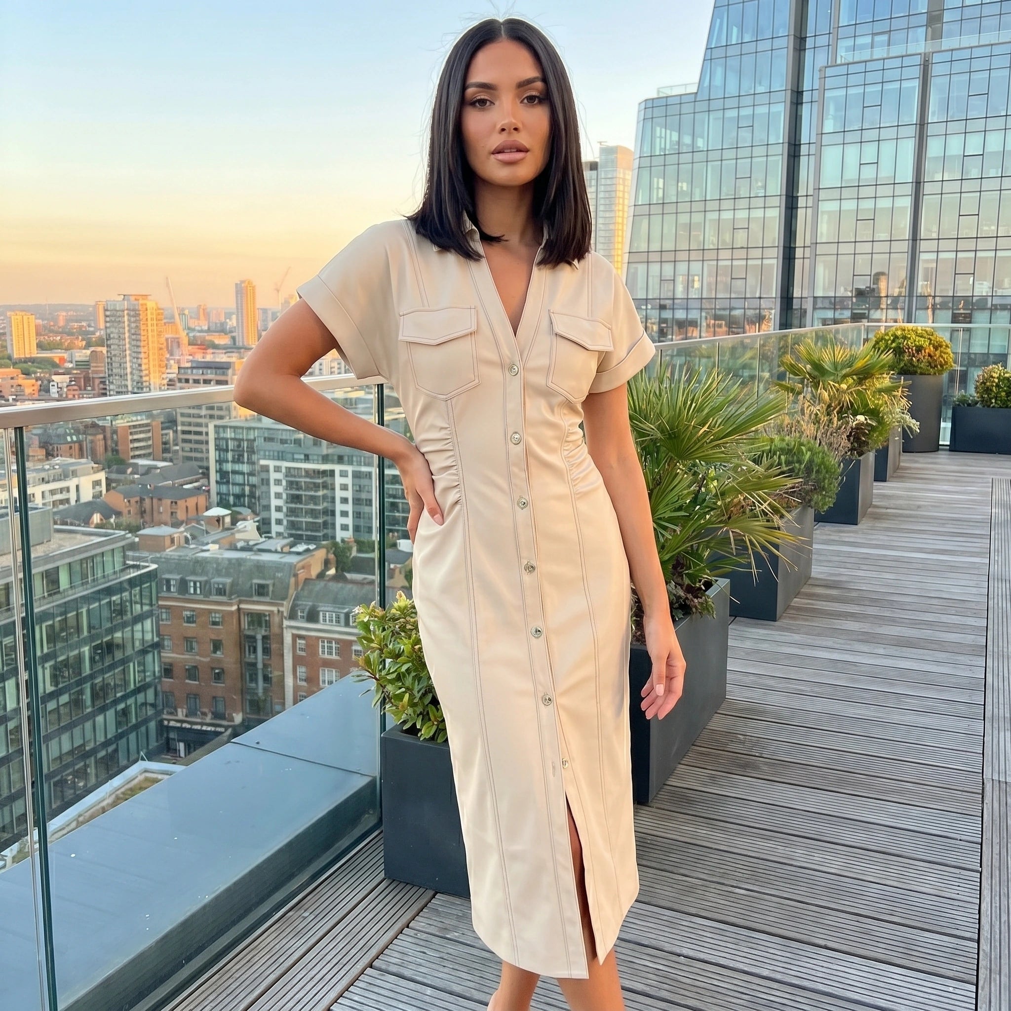 A model showcases the Womens Slim Midi Dress in a soft pastel color, styled with minimal accessories against a neutral backdrop.