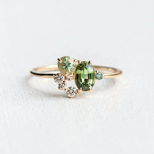 View of an elegant women's ring featuring a delicate design with a vibrant peridot gemstone set in silver