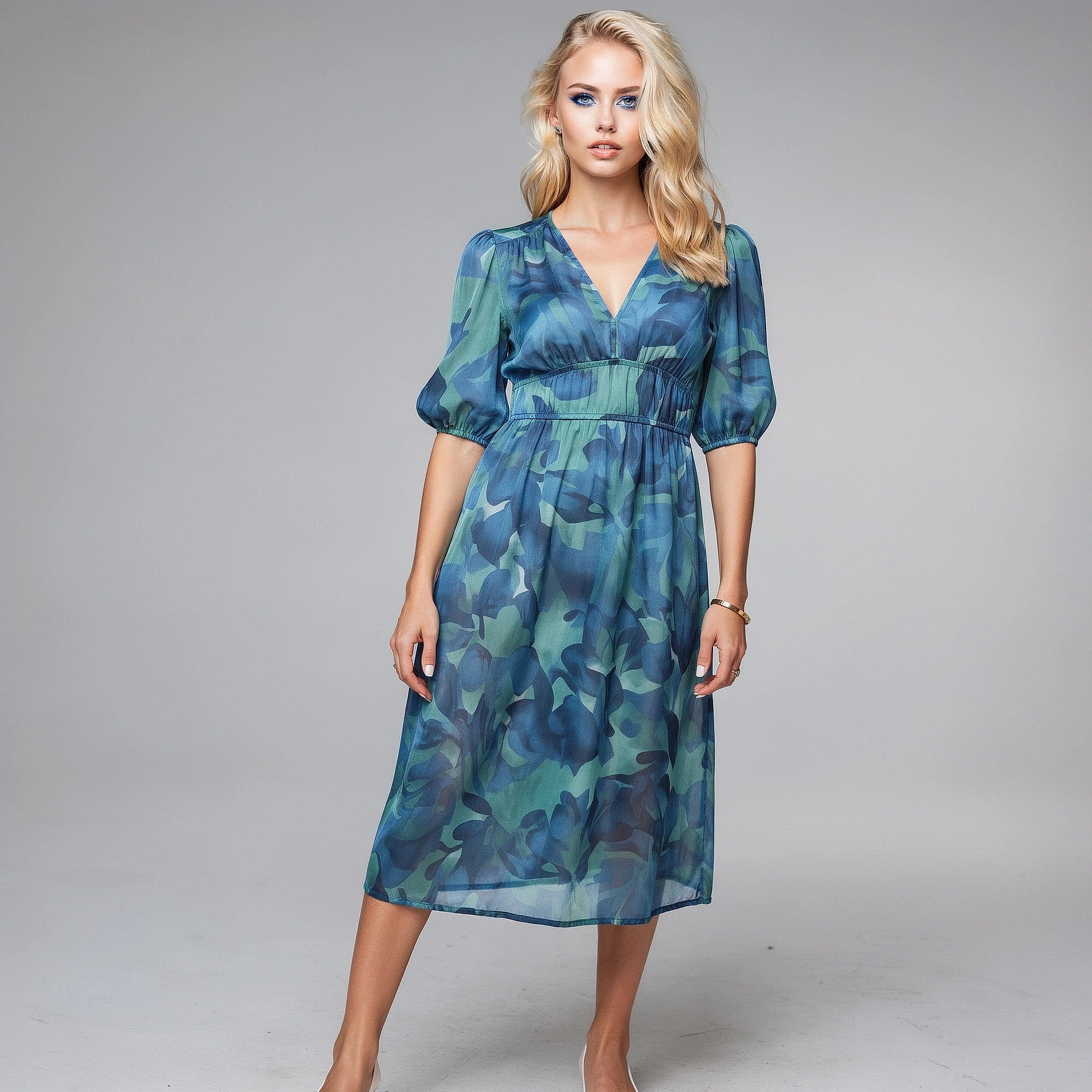 View of a floral midi dress featuring a fitted bodice, flowing skirt, and vibrant pink and green flower patterns