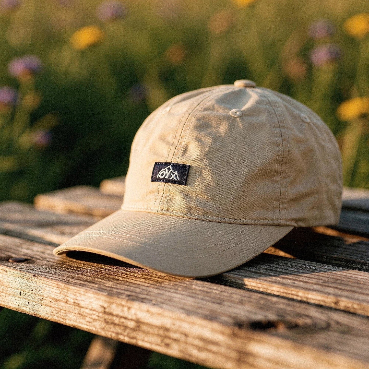 View of a stylish black baseball cap made from breathable fabric, featuring a curved brim and adjustable strap