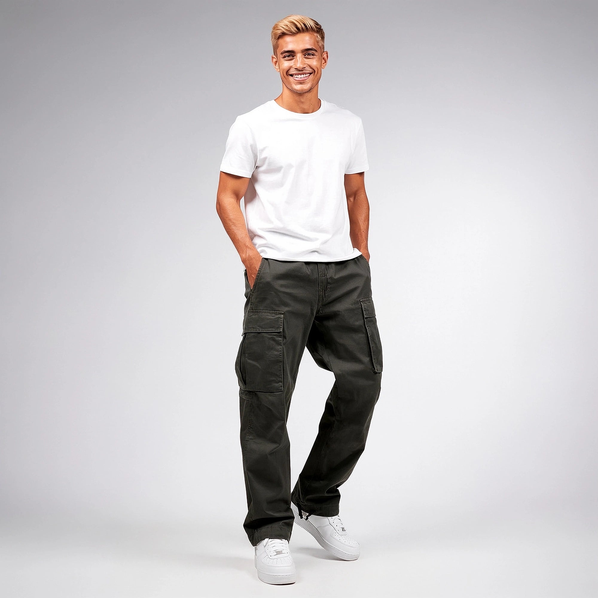 View of relaxed fit cargo pants in olive green, made of lightweight cotton with multiple pockets