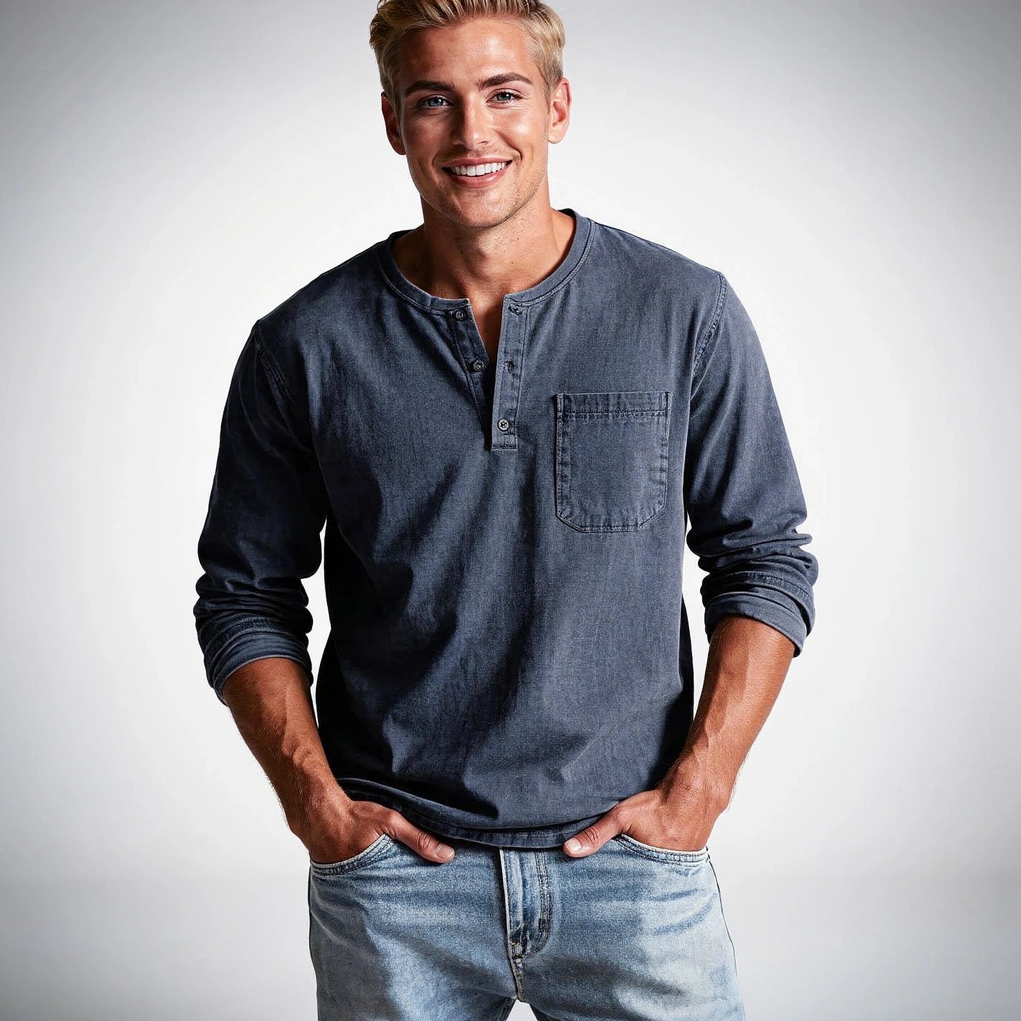 View of a casual long sleeve henley shirt in soft cotton, featuring a button placket and relaxed fit in a light gray color