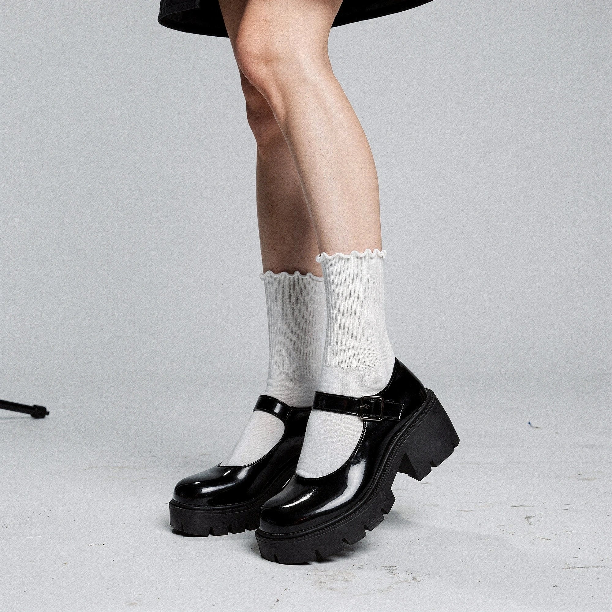 View of charming vintage platform Mary Jane high heels in soft pink leather with a rounded toe and ankle strap