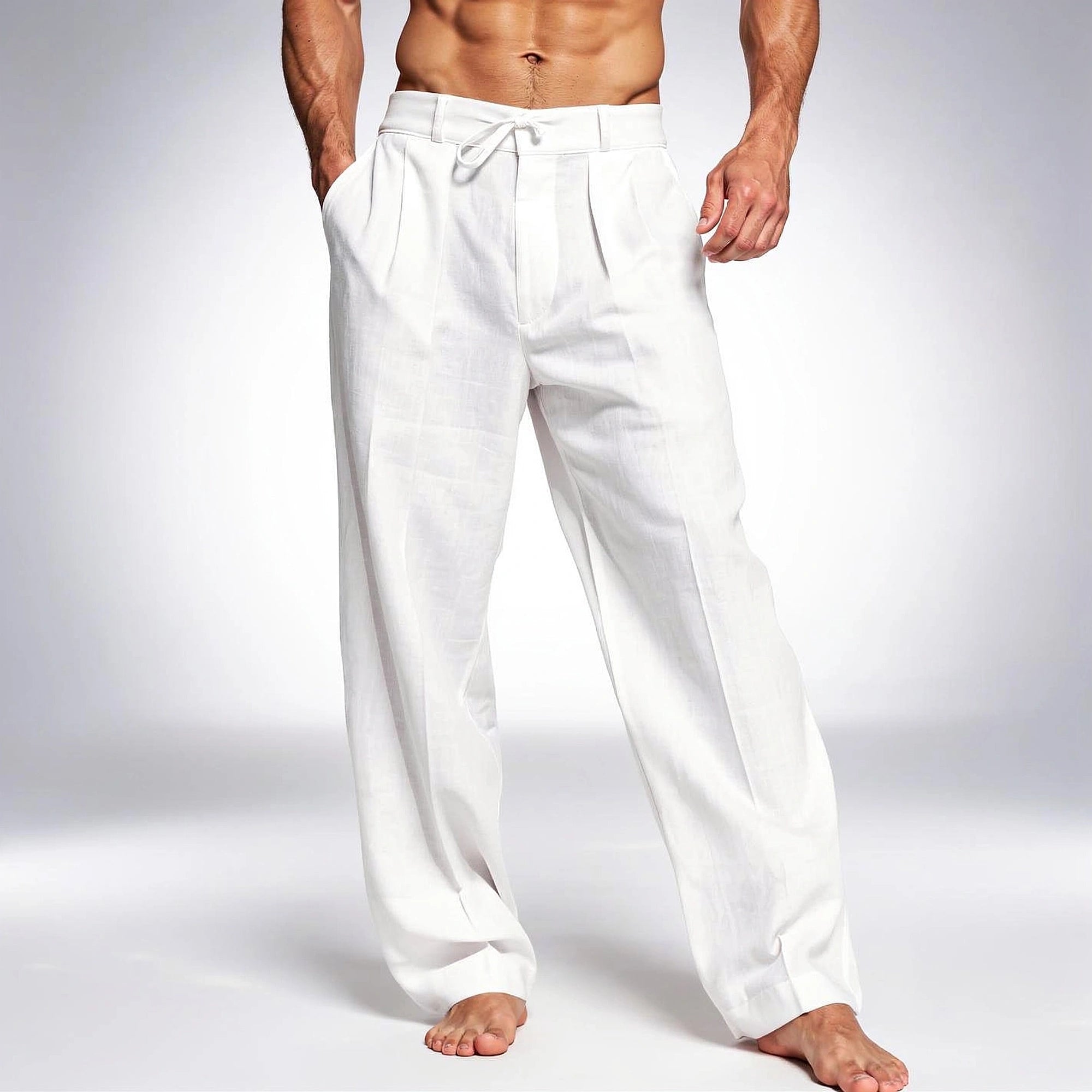 View of relaxed drawstring pants in light gray fabric, featuring an elastic waistband and pockets