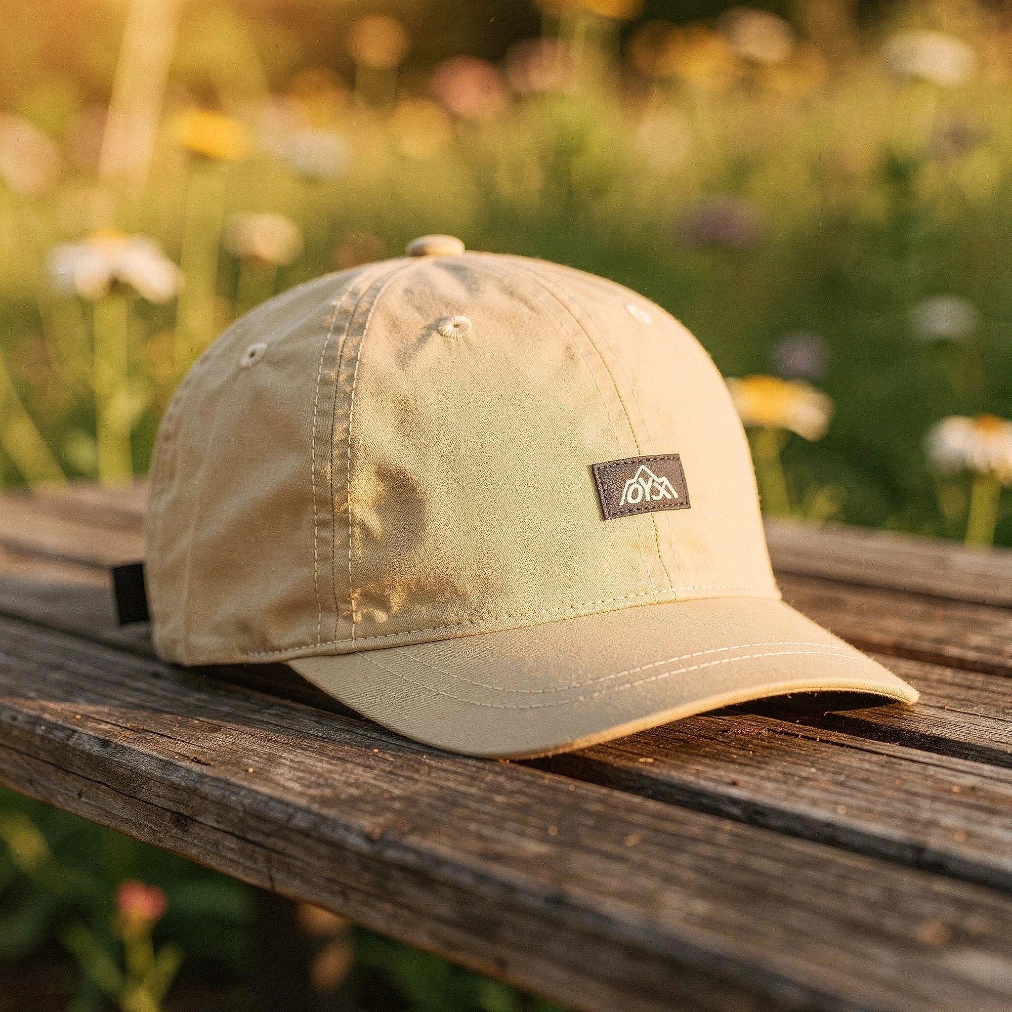 View of a stylish men's baseball cap in dark gray, made from breathable fabric, featuring a curved brim and ventilation holes