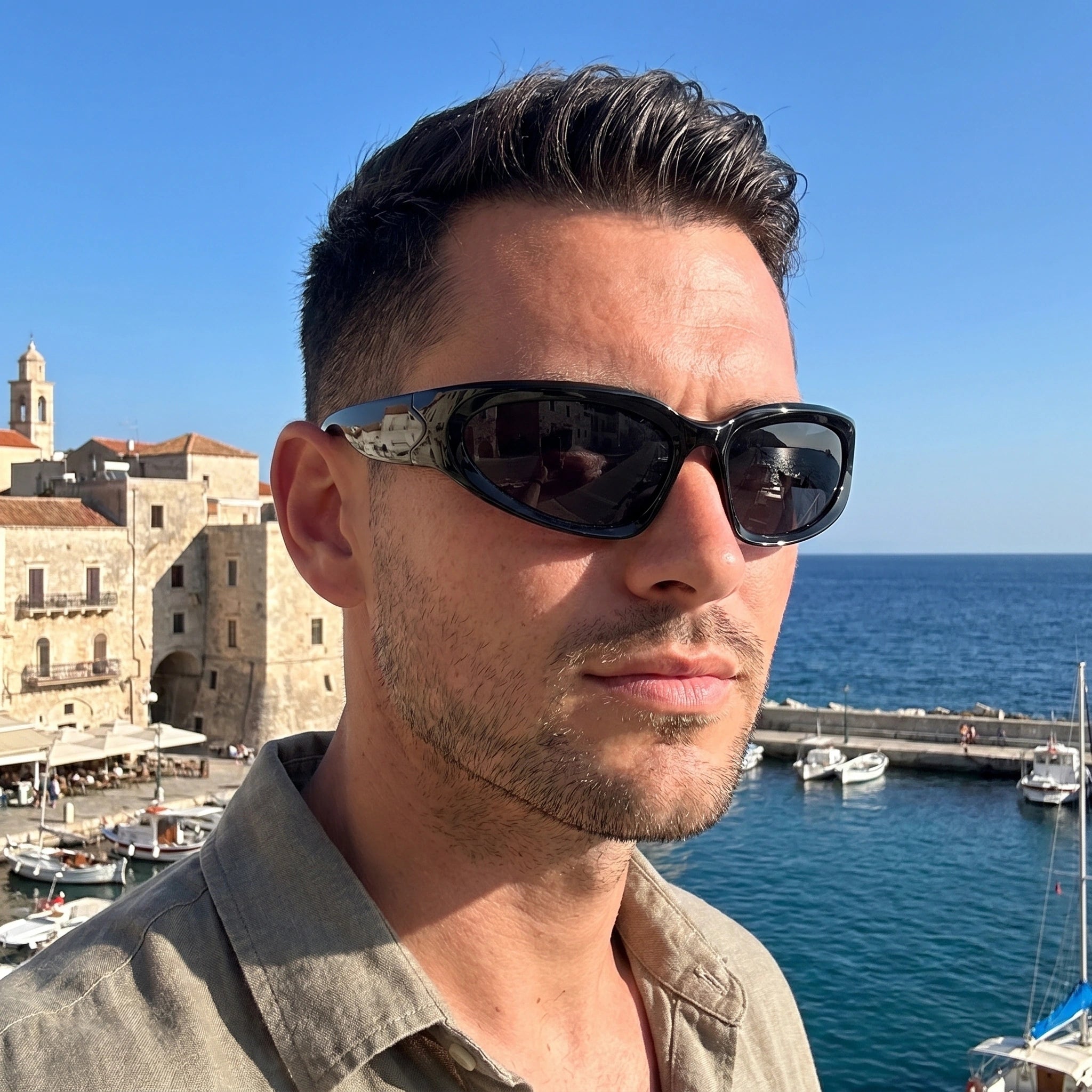 Close up view of the Men's Bold Retro Vintage Sunglasses showing intricate detailing and stitching against a neutral background, showing their design.