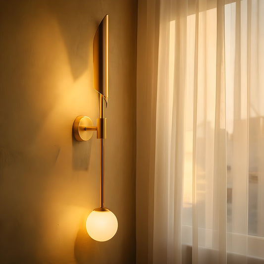 View of a brass wall sconce fixture featuring a refined Nordic design with dual light sources and elegant curves
