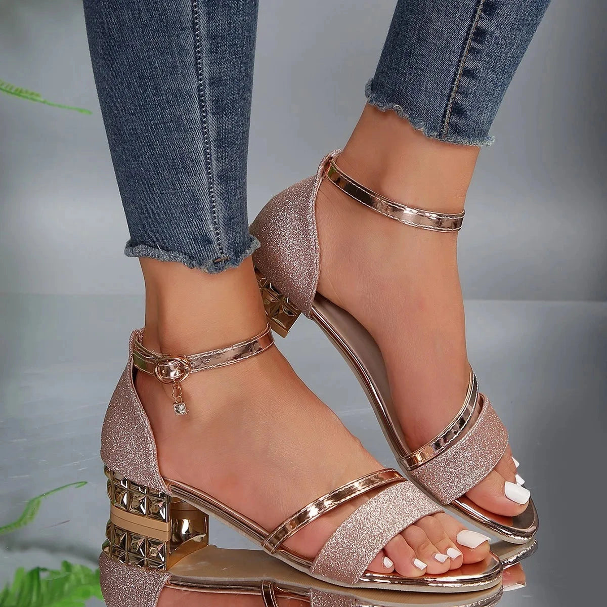 View of elegant supportive sandals featuring a soft beige upper, adjustable ankle strap, and cushioned footbed