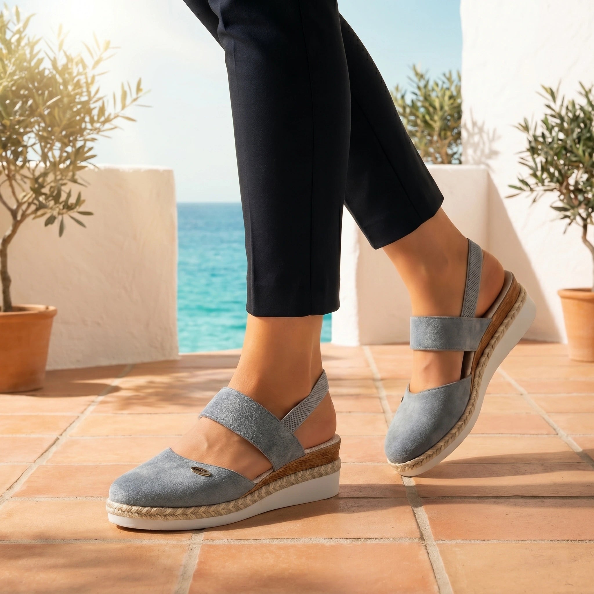 Close up view showing the soft fabric and intricate stitching of women's comfortable summer sandals in a colorful against a neutral background.