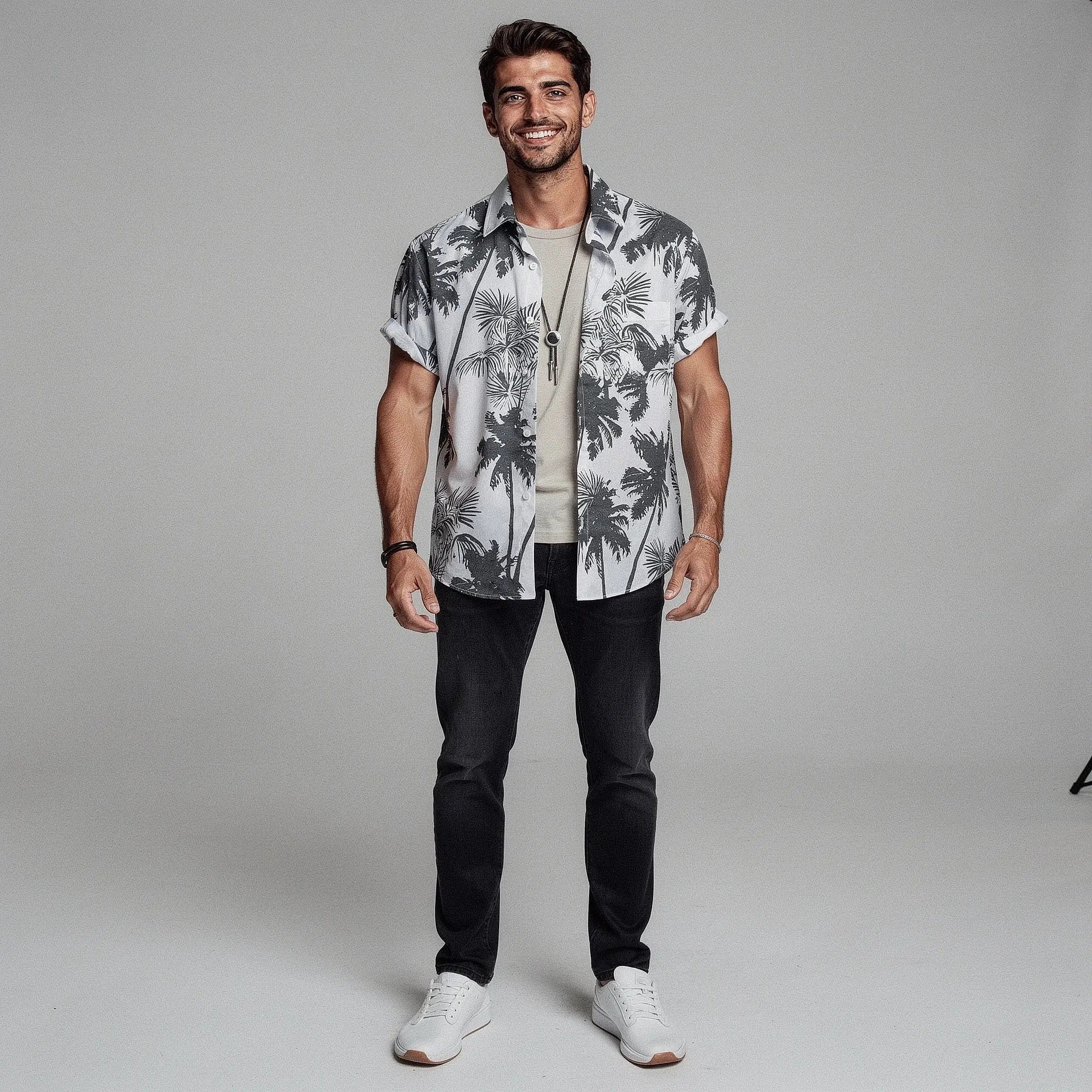 View of a slim fit short sleeve Hawaiian shirt featuring a vibrant floral print in shades of blue and green