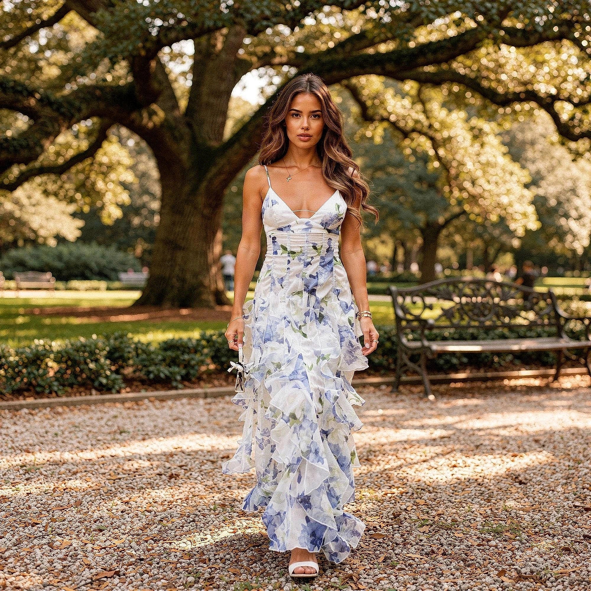 View of a flowy maxi dress featuring cut out details, in a soft pastel color, made