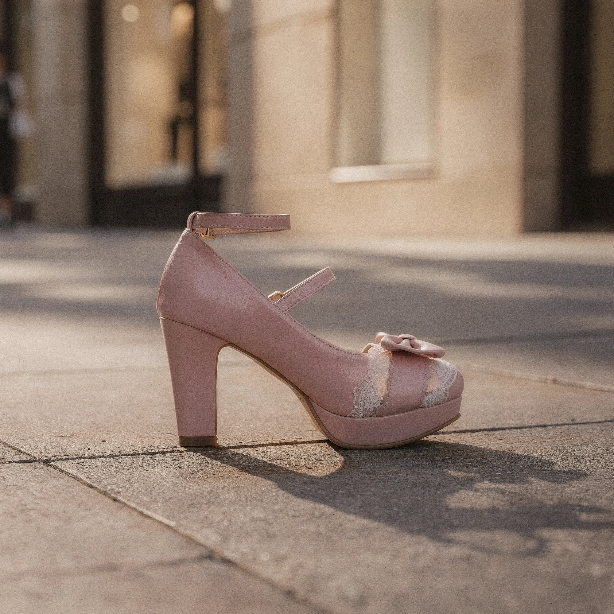 View of elegant high heeled shoes in soft velvet, featuring lace frill accents and a charming design