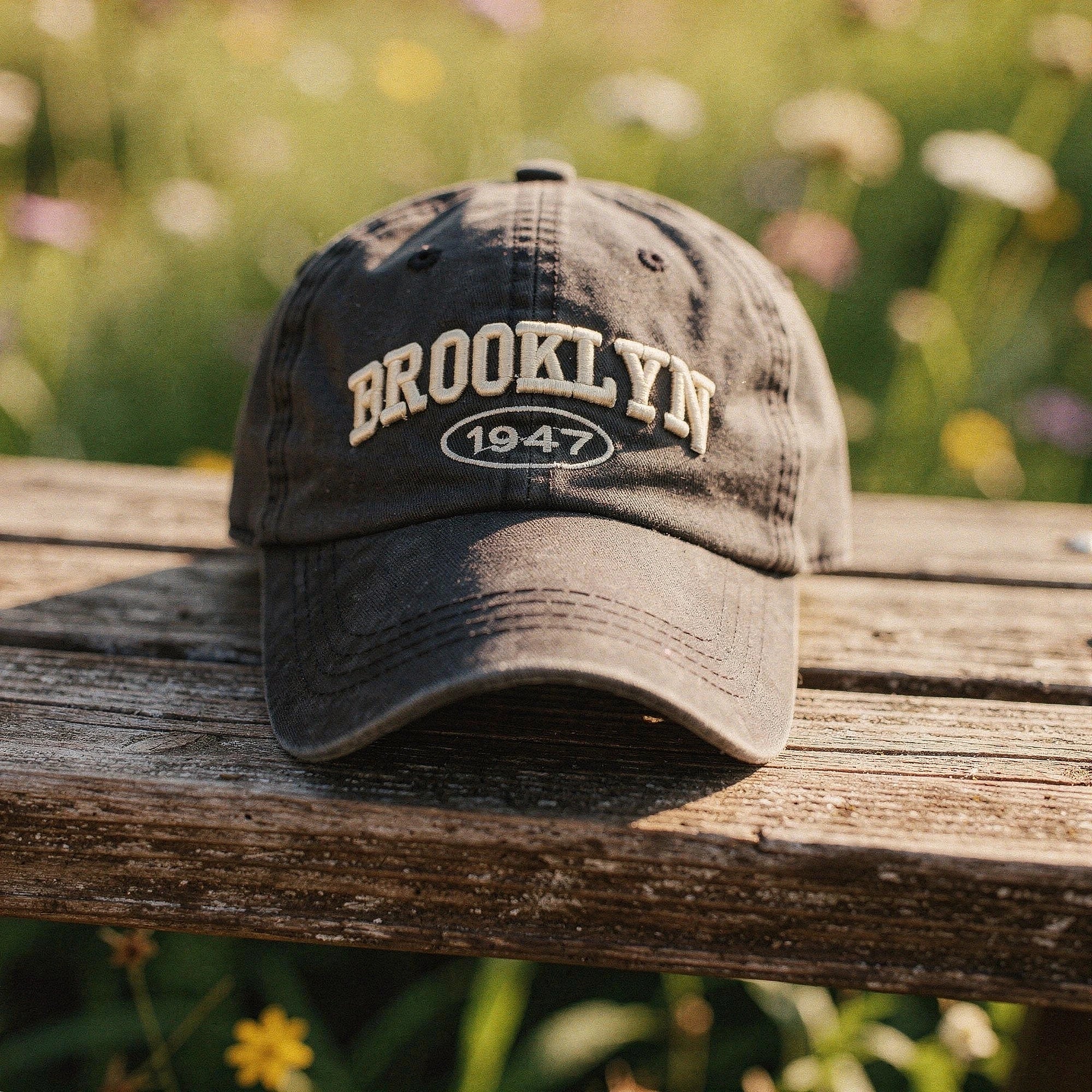 View of a men's casual cap featuring intricate embroidery, in a rich navy blue color with a relaxed fit
