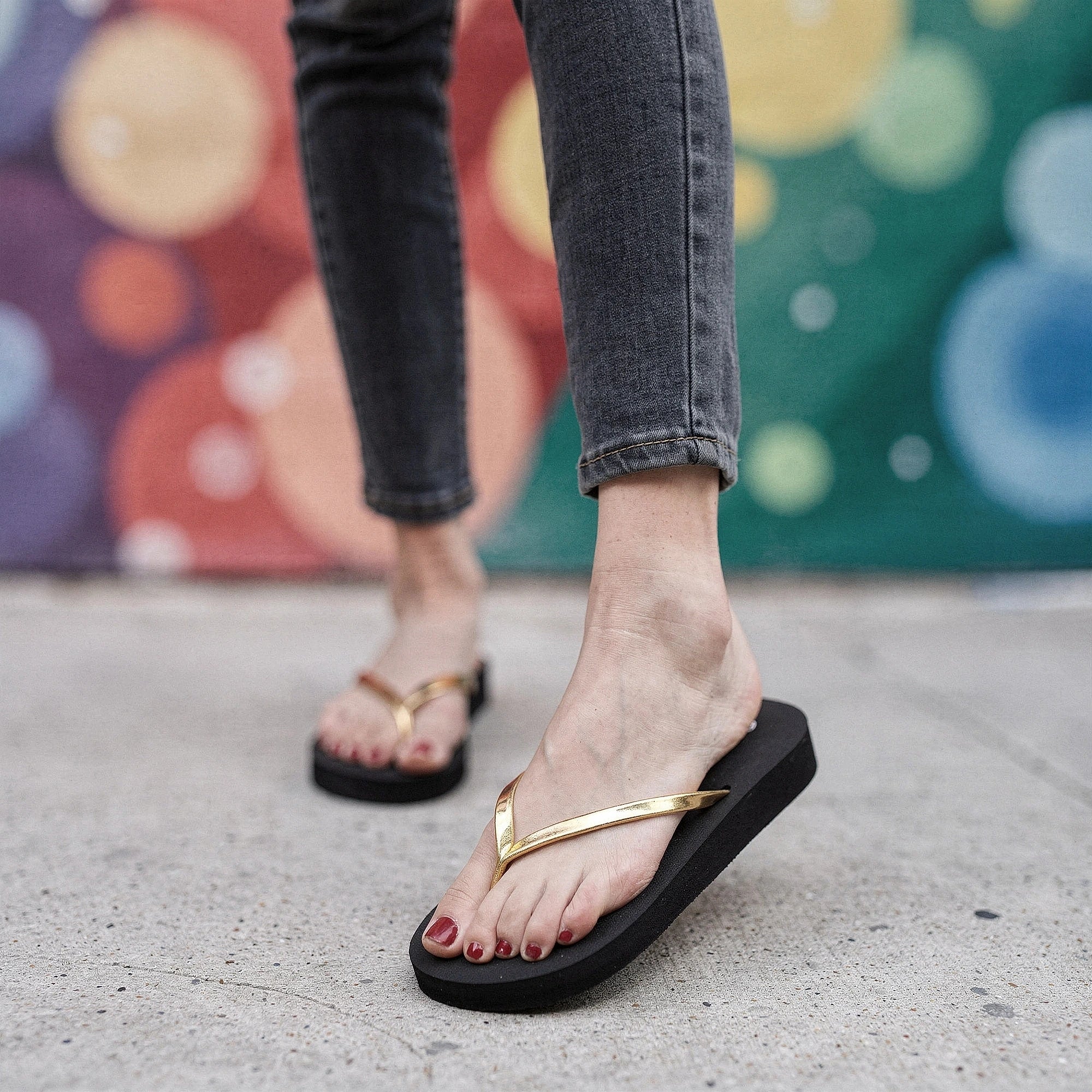 Lightweight flat beach sandals for women in vibrant coral, featuring adjustable straps and a cushioned footbed, view