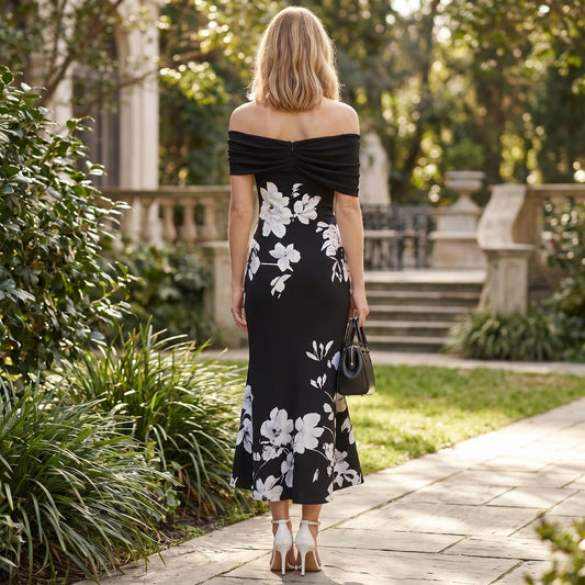 A model showcases the Womens Effortless Midi Dress in a soft pastel hue, styled with minimal accessories against a neutral backdrop.
