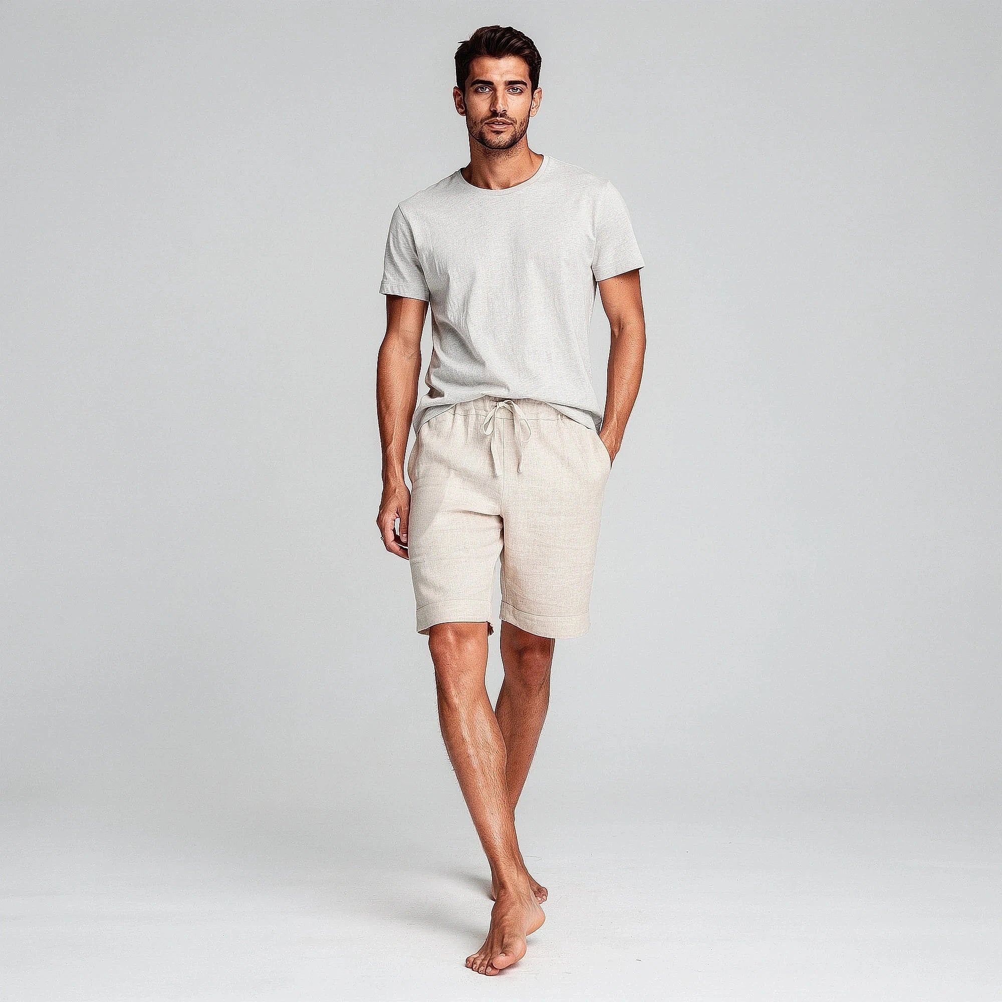 Lightweight casual shorts in a soft gray fabric, featuring an elastic waistband and pockets, view