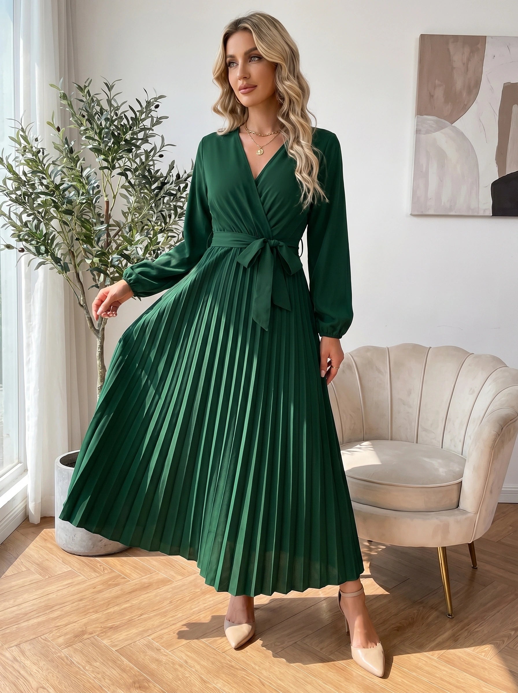 Close up view of the Womens Pleated Maxi Dress showing intricate pleating details and high quality stitching in a soft pastel hue against a neutral background.