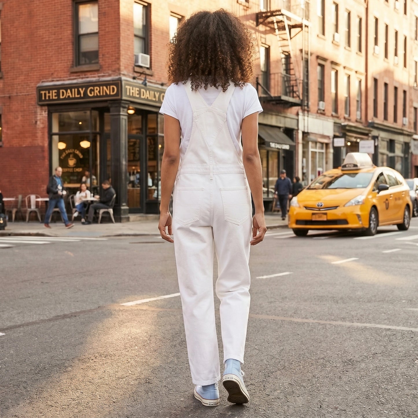 Close up view of the women's effortless jumpsuit showing its soft fabric, precise stitching, and design details against a neutral background.