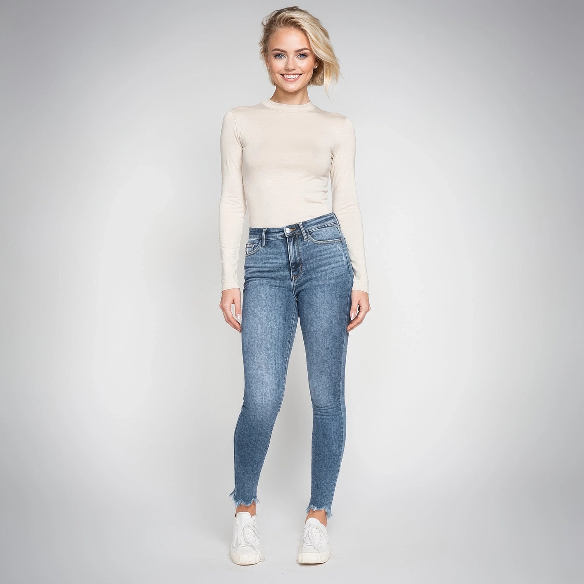 View of stylish high waist skinny jeans in dark blue denim, featuring a fitted silhouette and classic five pocket design