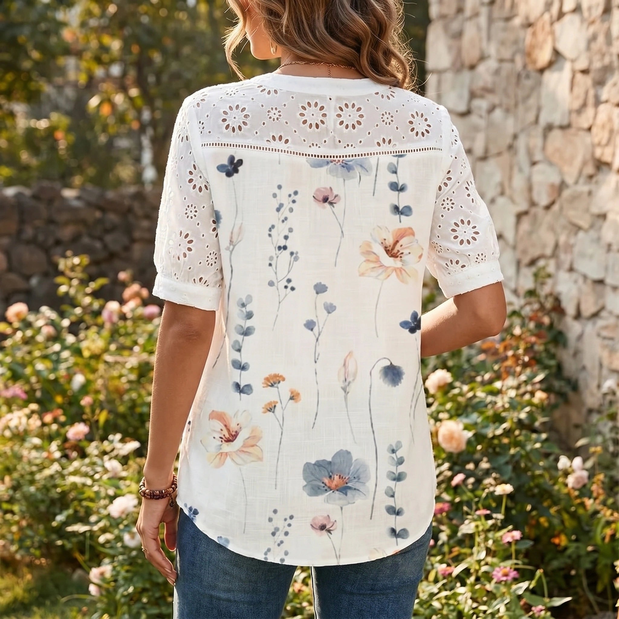 Close up showing the soft fabric and intricate stitching details of the Womens Relaxed Summer Blouse in a light, airy color.