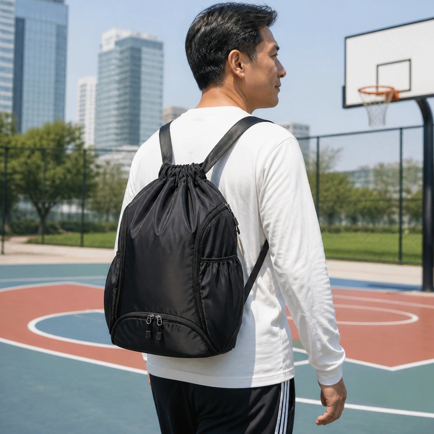 drawstring backpack — Adult wearing the black drawstring sports backpack at a basketball court — view 8