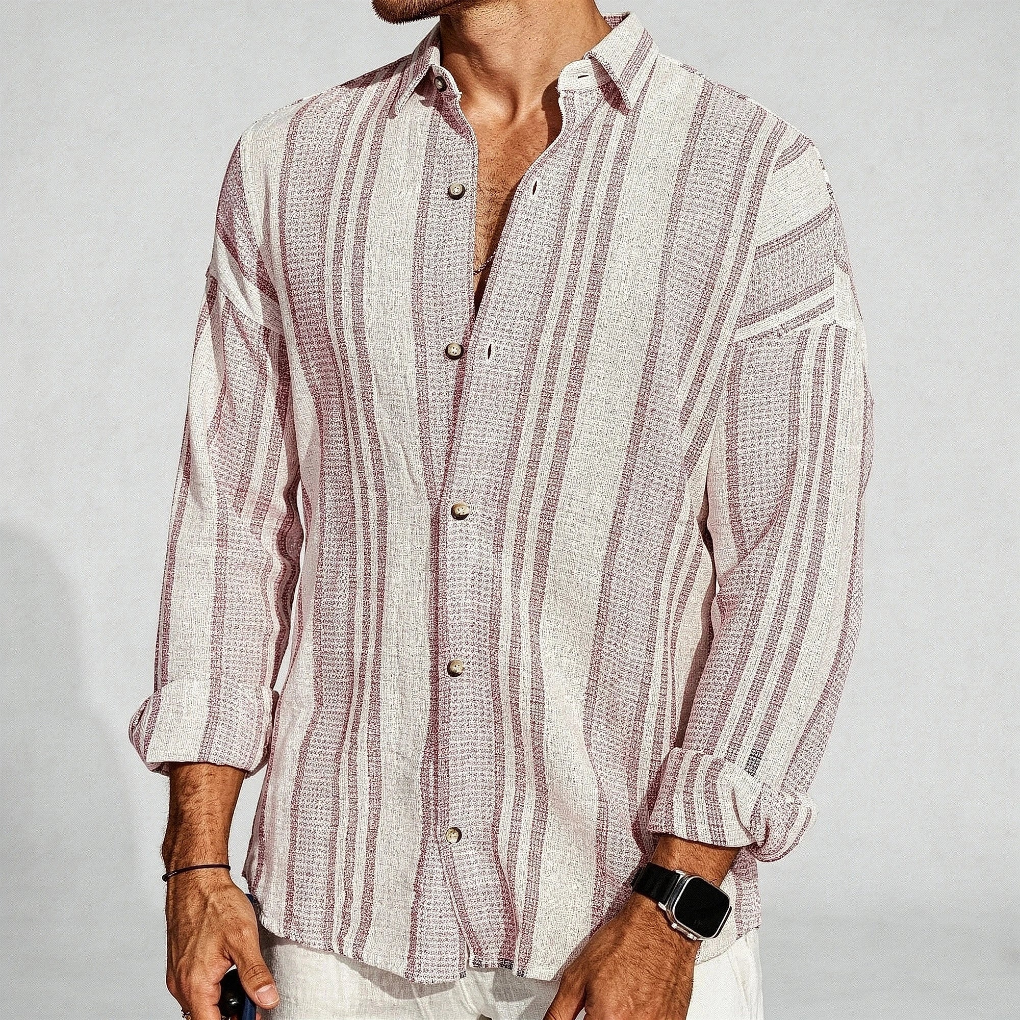 Lightweight button up shirt in light blue, featuring a relaxed fit and buttons, shown