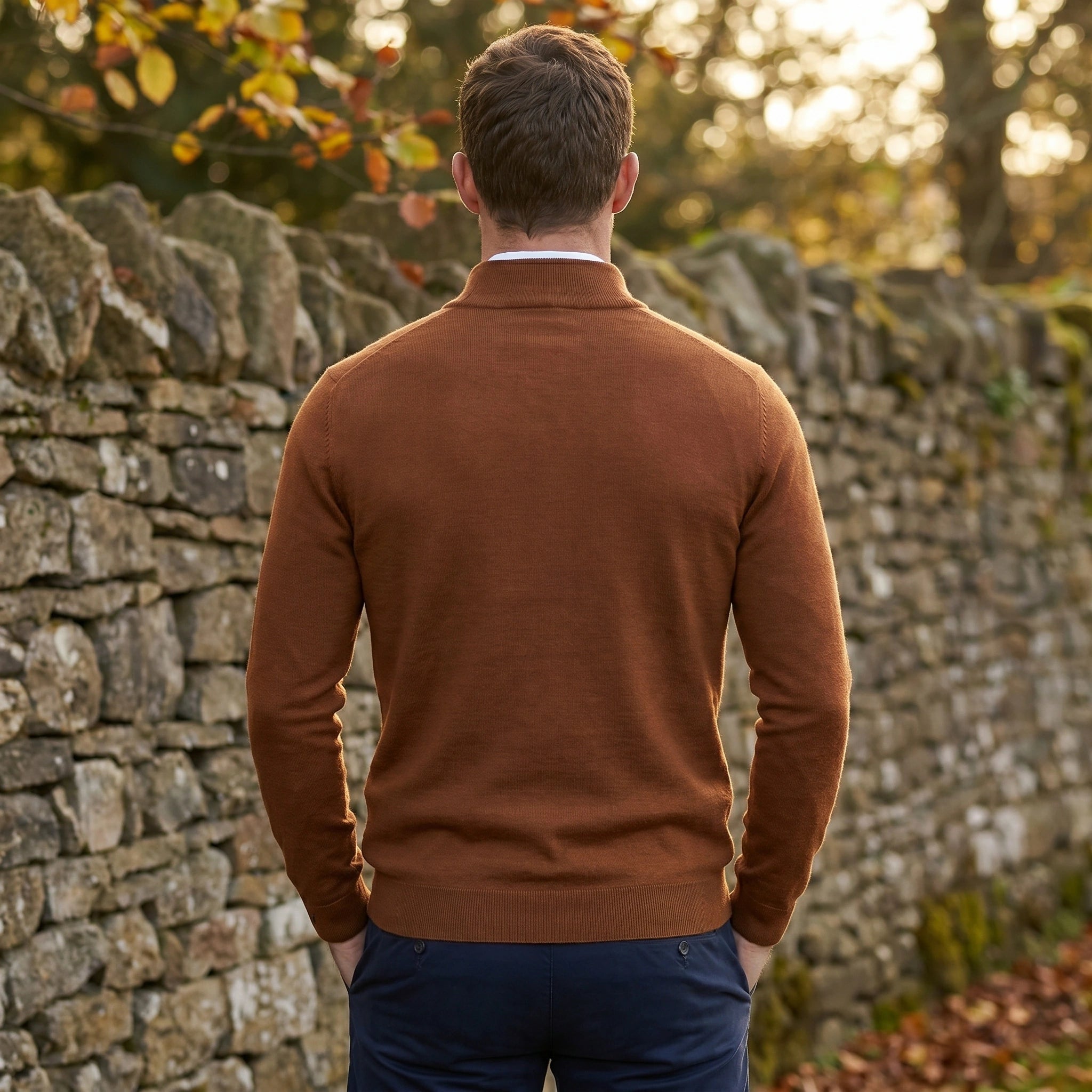 Close up of the men's fitted quarter zip sweater showing the soft fabric texture and precise stitching in a classic navy color.