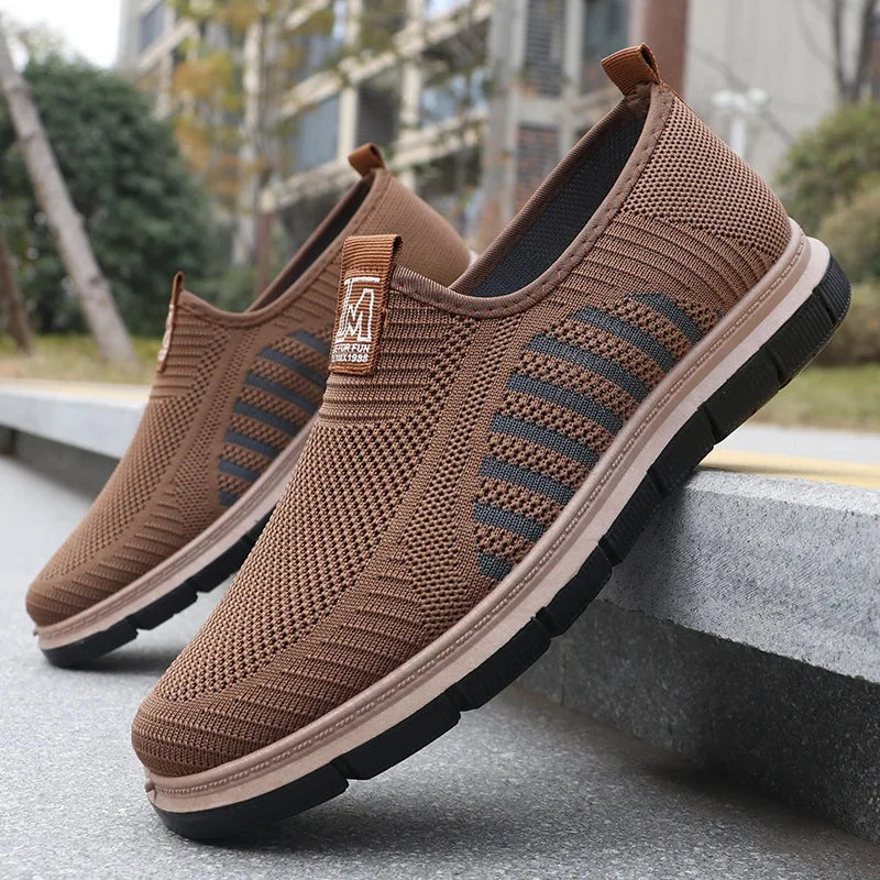 View of stylish knit upper shoes in dark gray, featuring a casual design and comfortable fit