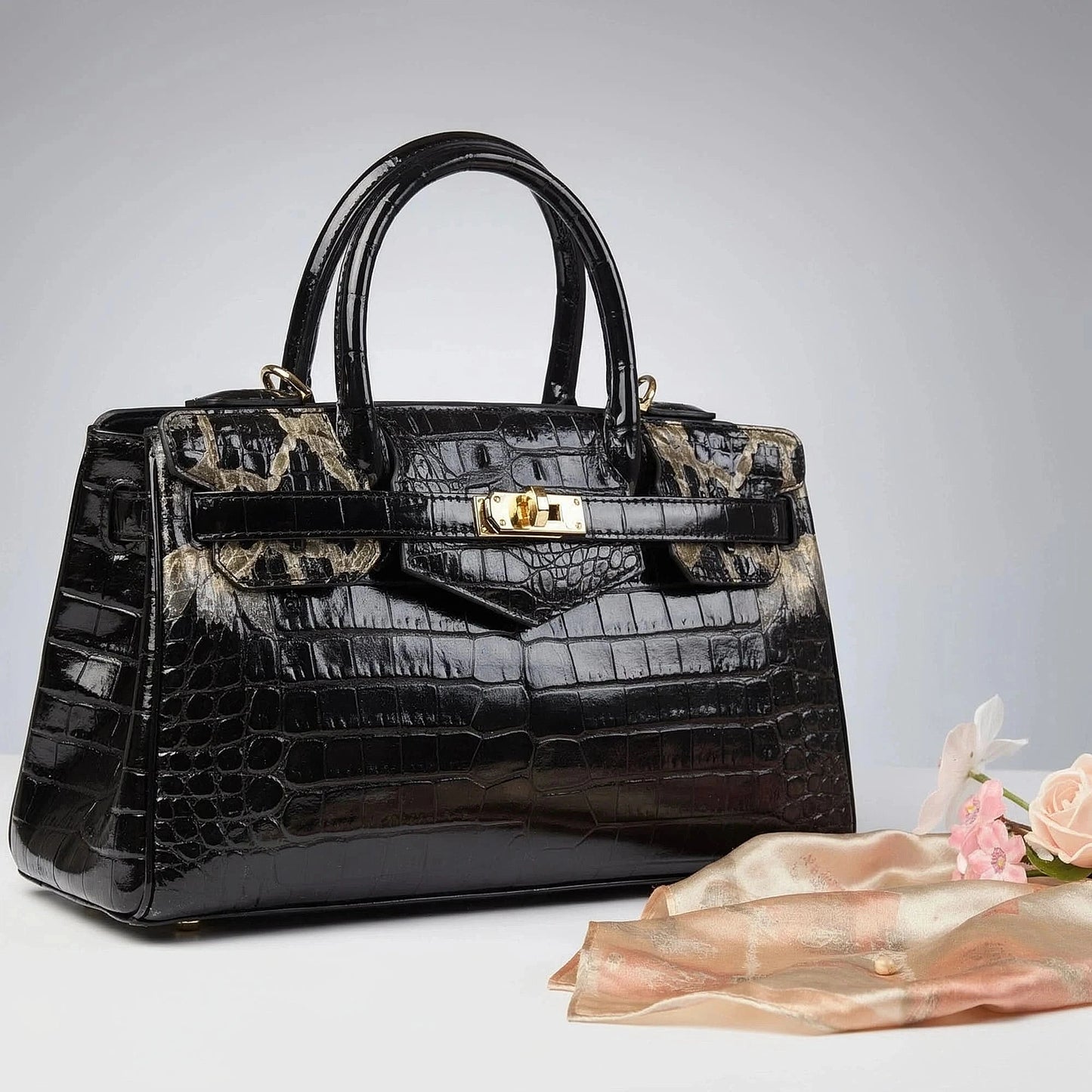 View of a chic textured leather shoulder bag in deep burgundy, showcasing its large capacity and elegant design features
