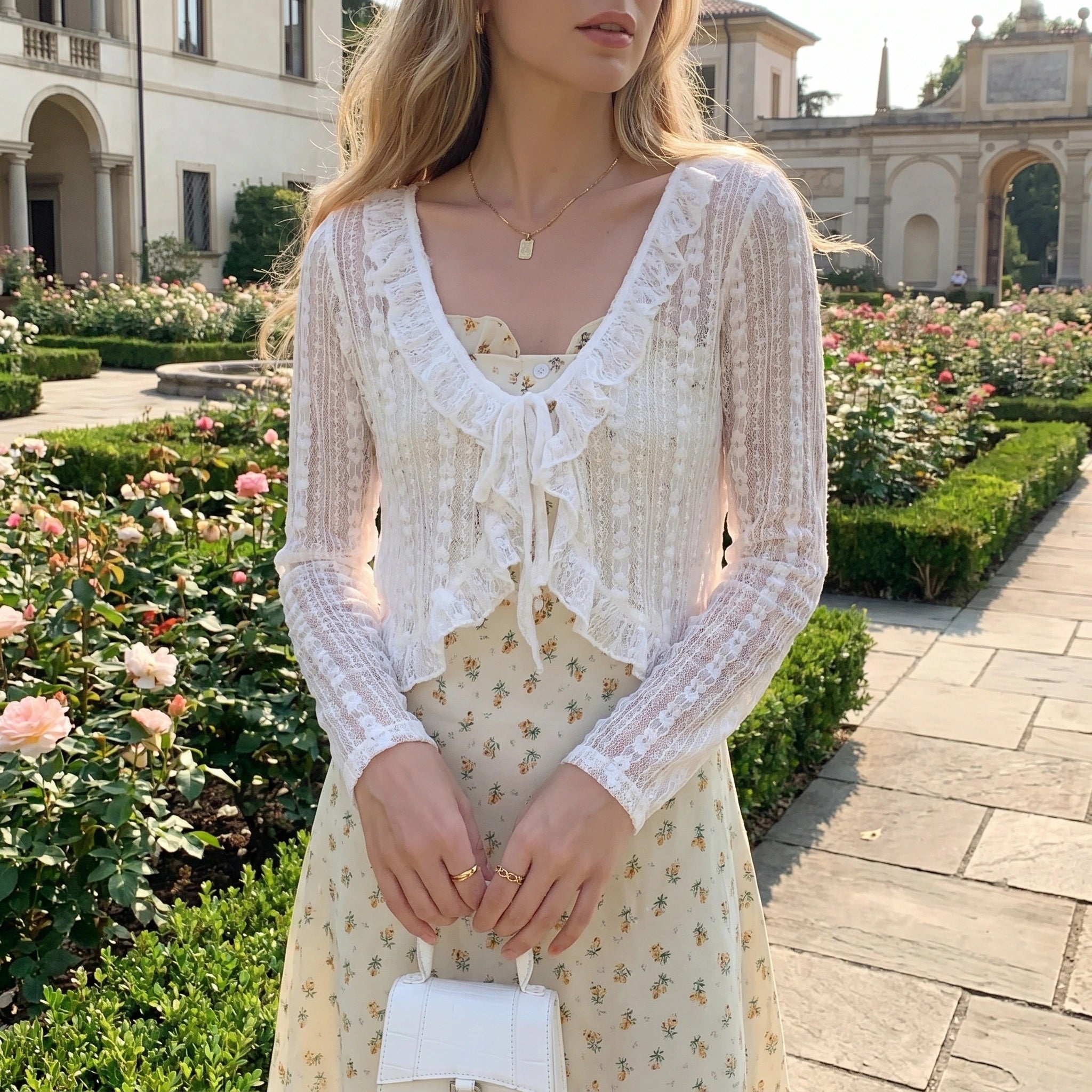 Close up view of the Womens Delicate Ruffled Summer Blouse showing intricate stitching and soft fabric texture, perfect for adding a playful touch to summer outfits.