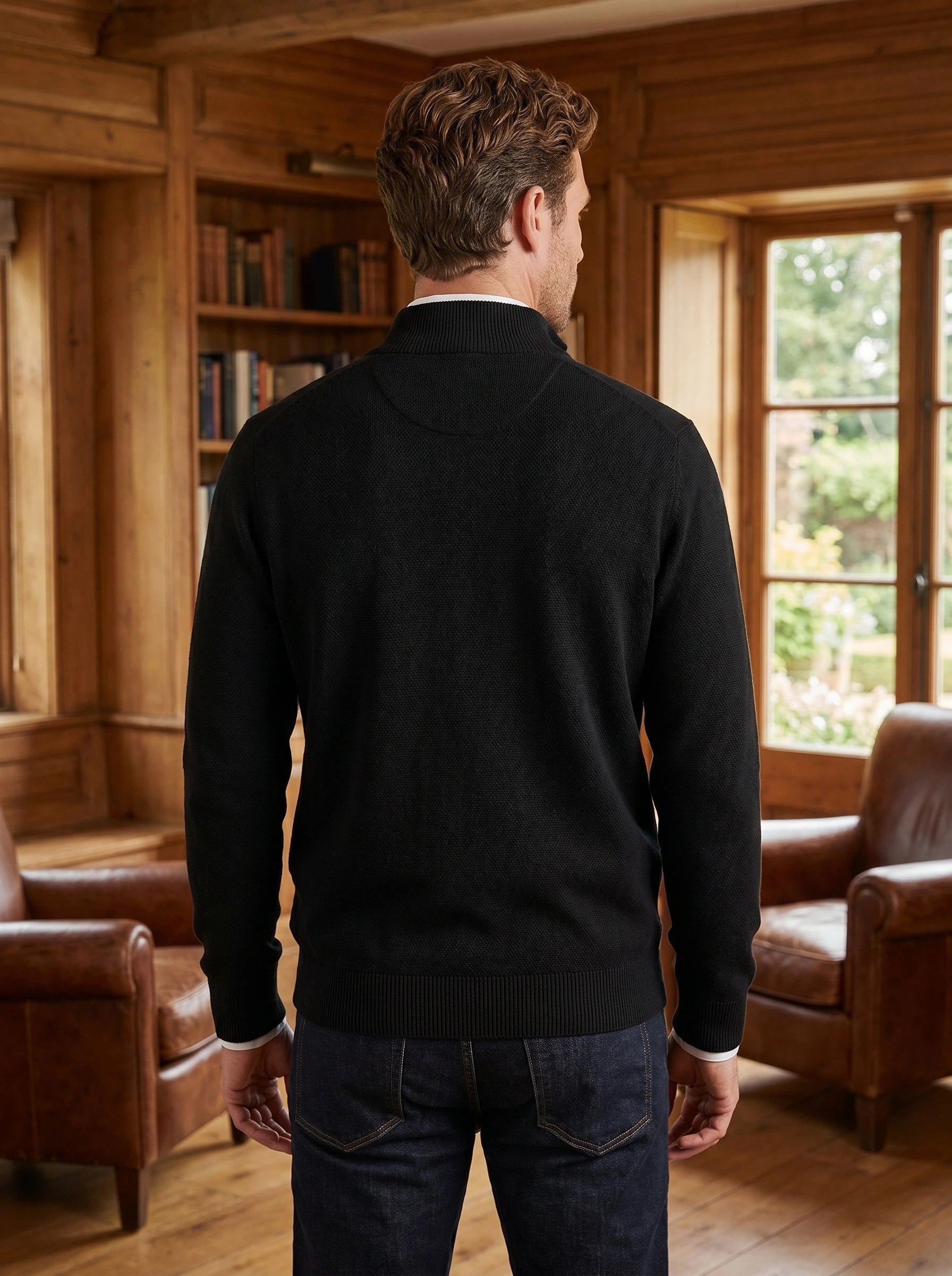 Close up of the Men's Elevated Texture Quarter Zip Sweater showing the rich fabric texture and precise stitching against a neutral background.